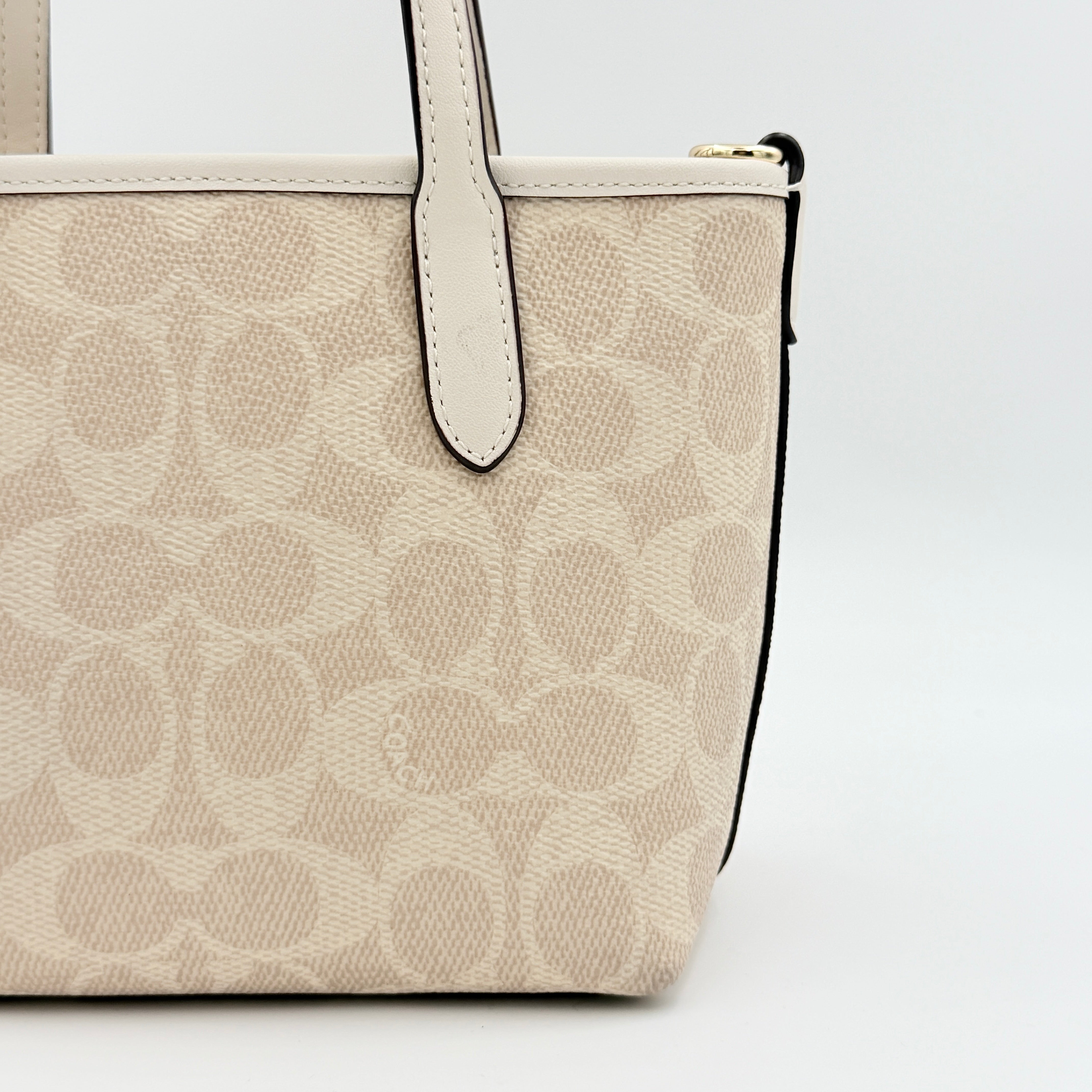Coach 2Way Mini City Tote in beige and white with signature jacquard, shown with detachable logo canvas strap.