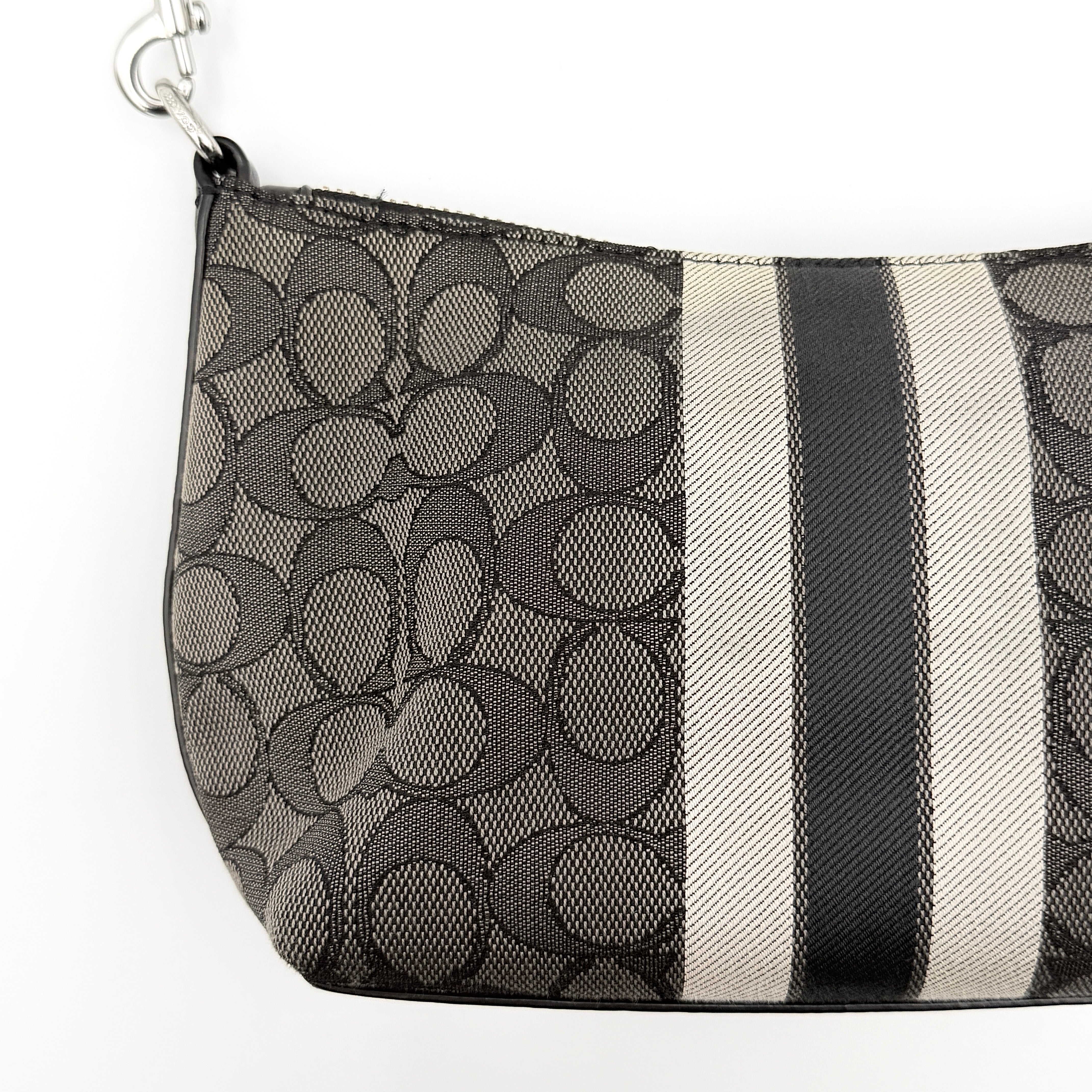The Coach 2Way Signature Dempsey Stripe Shoulder Bag in black and grey canvas with detachable straps, shown flat on a white background.