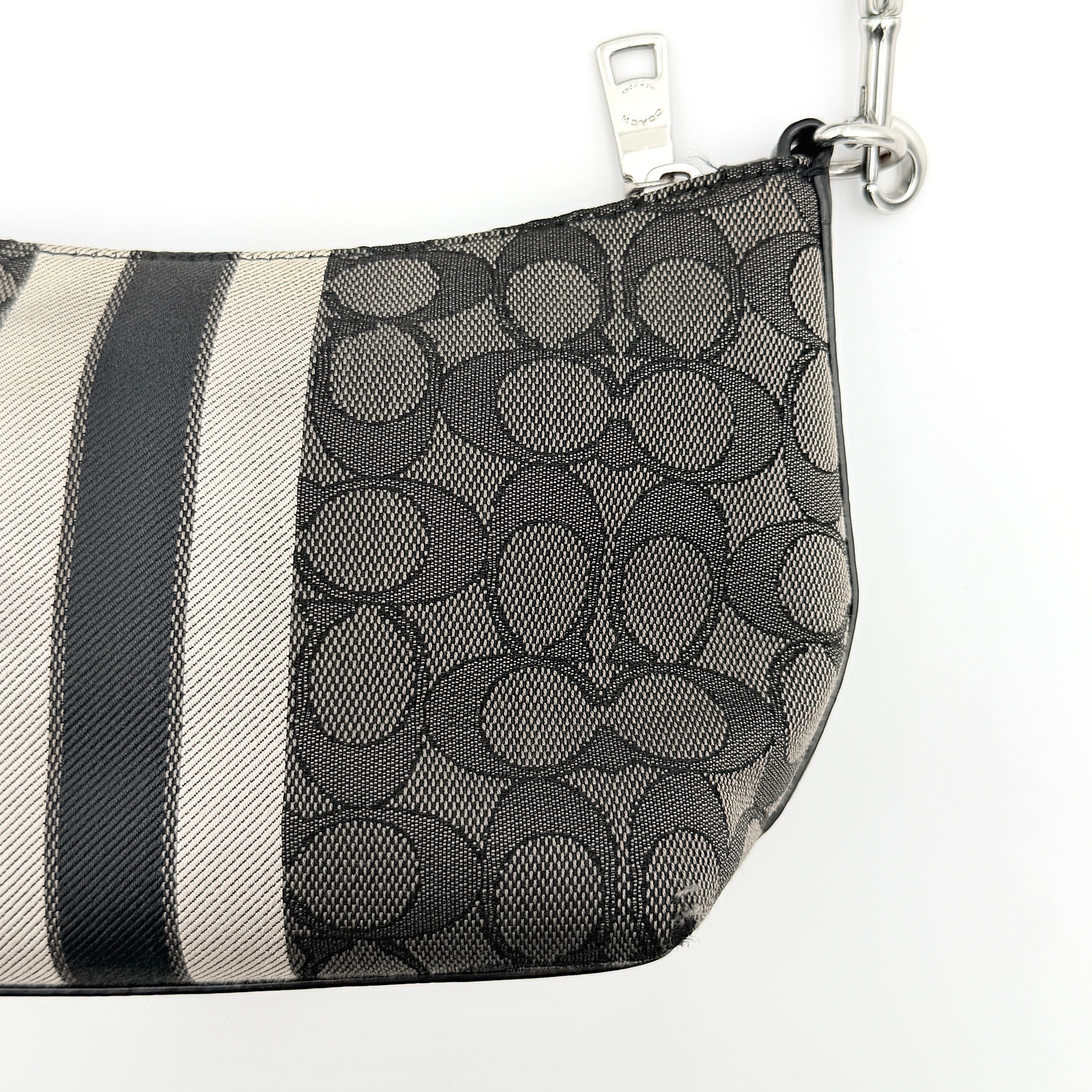 The Coach 2Way Signature Dempsey Stripe Shoulder Bag in black and grey canvas with detachable straps, shown flat on a white background.