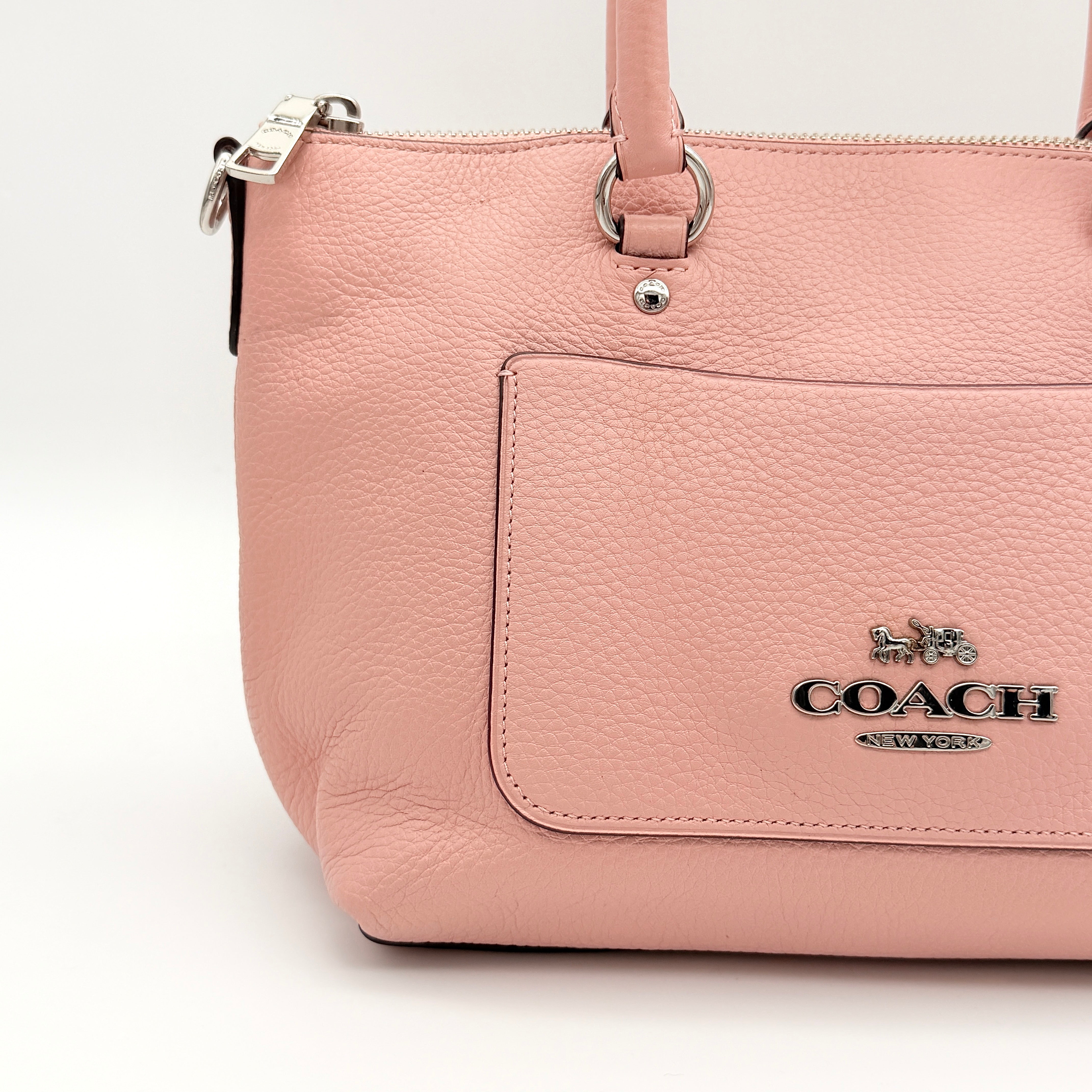 Coach Mini Emma Satchel in pink pebbled leather with silver-tone hardware, shown with detachable strap.
