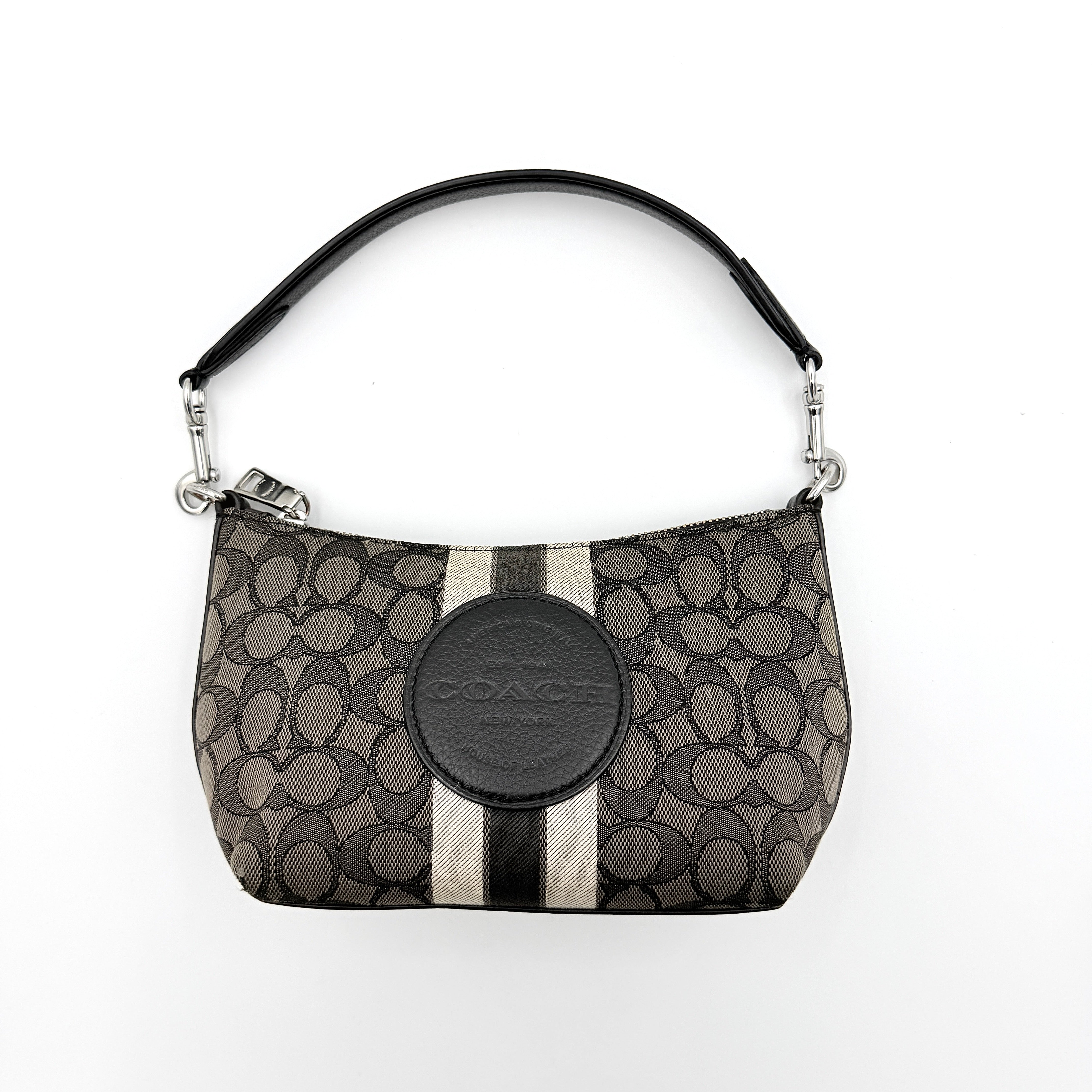 The Coach 2Way Signature Dempsey Stripe Shoulder Bag in black and grey canvas with detachable straps, shown flat on a white background.