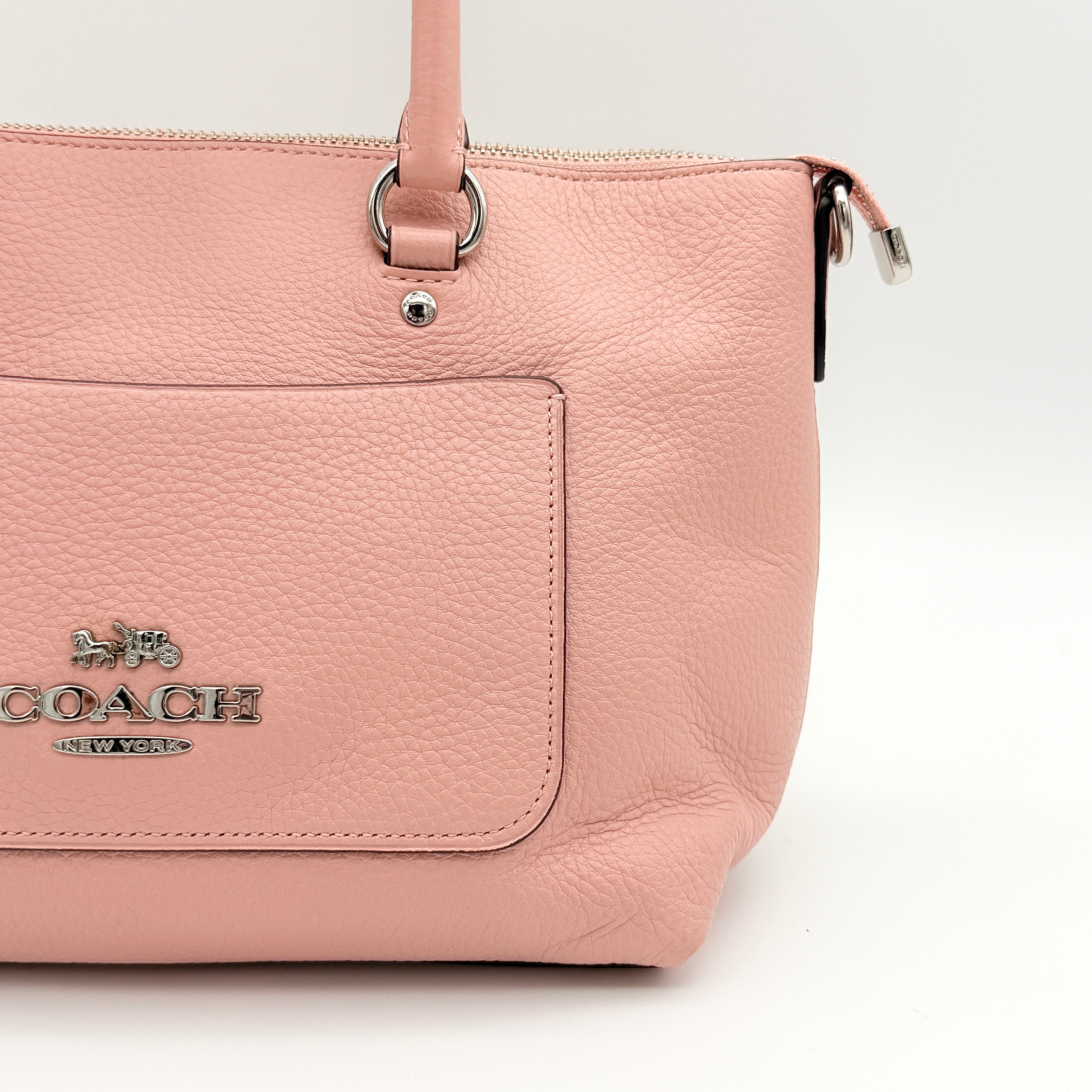 Coach Mini Emma Satchel in pink pebbled leather with silver-tone hardware, shown with detachable strap.