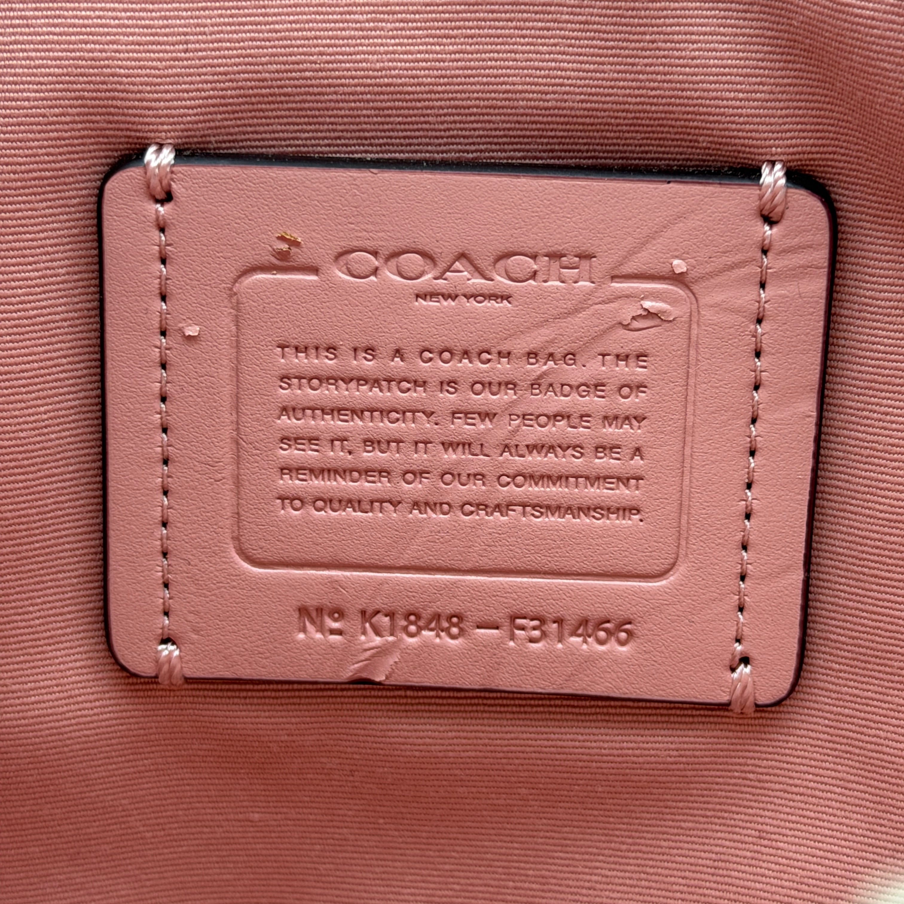 Coach Mini Emma Satchel in pink pebbled leather with silver-tone hardware, shown with detachable strap.