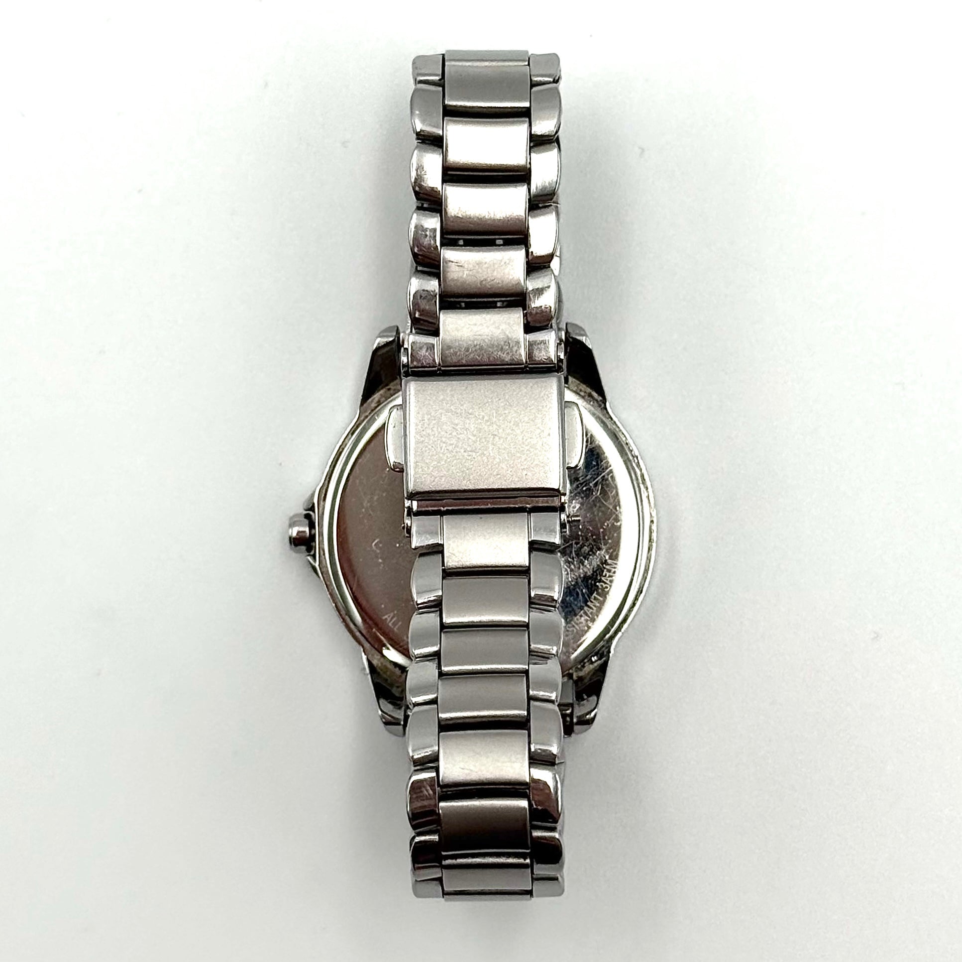 Coach CA.13.7.14.0431 stainless steel watch with brown dial and silver-tone bracelet, presented on a black cushion.