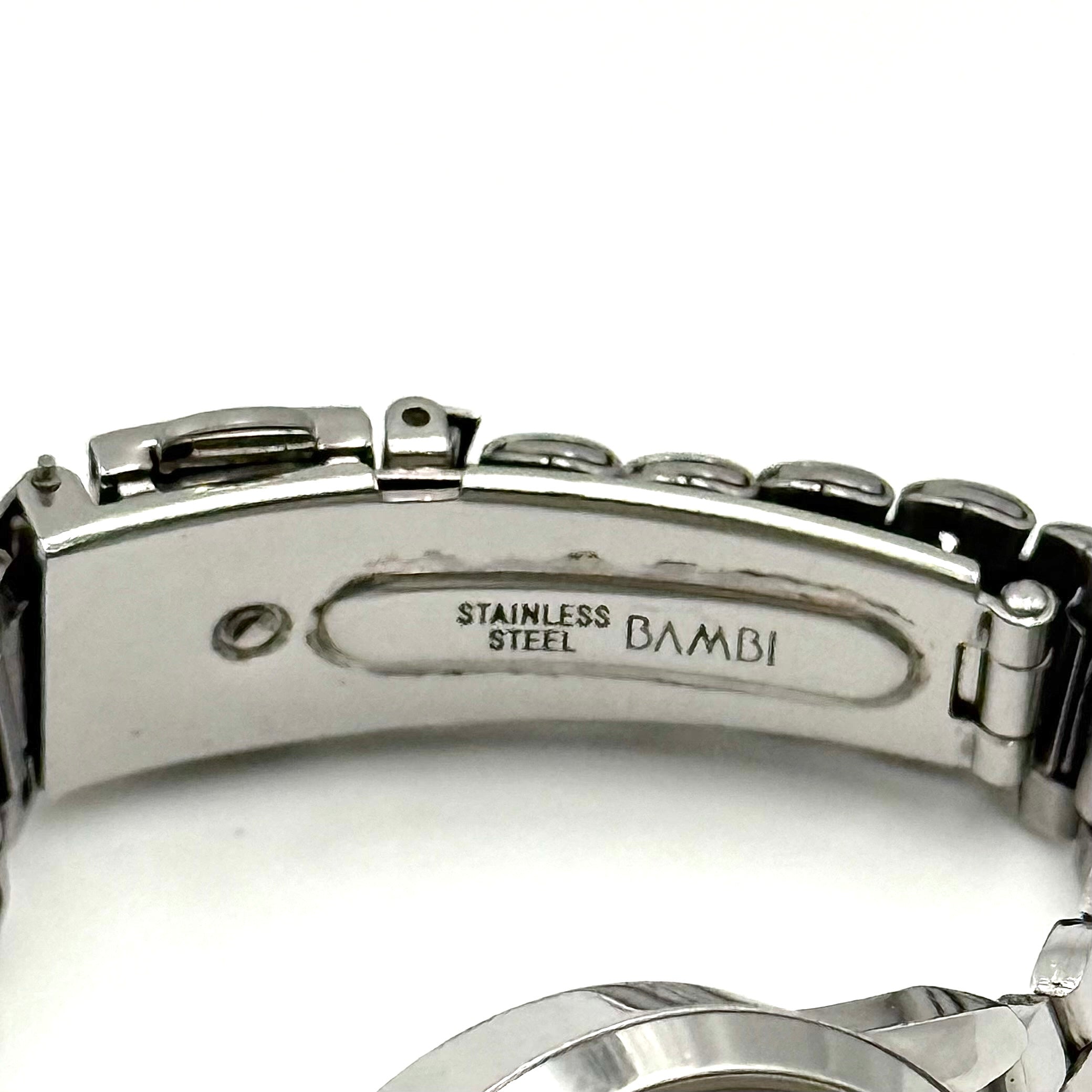 Coach CA.13.7.14.0431 stainless steel watch with brown dial and silver-tone bracelet, presented on a black cushion.