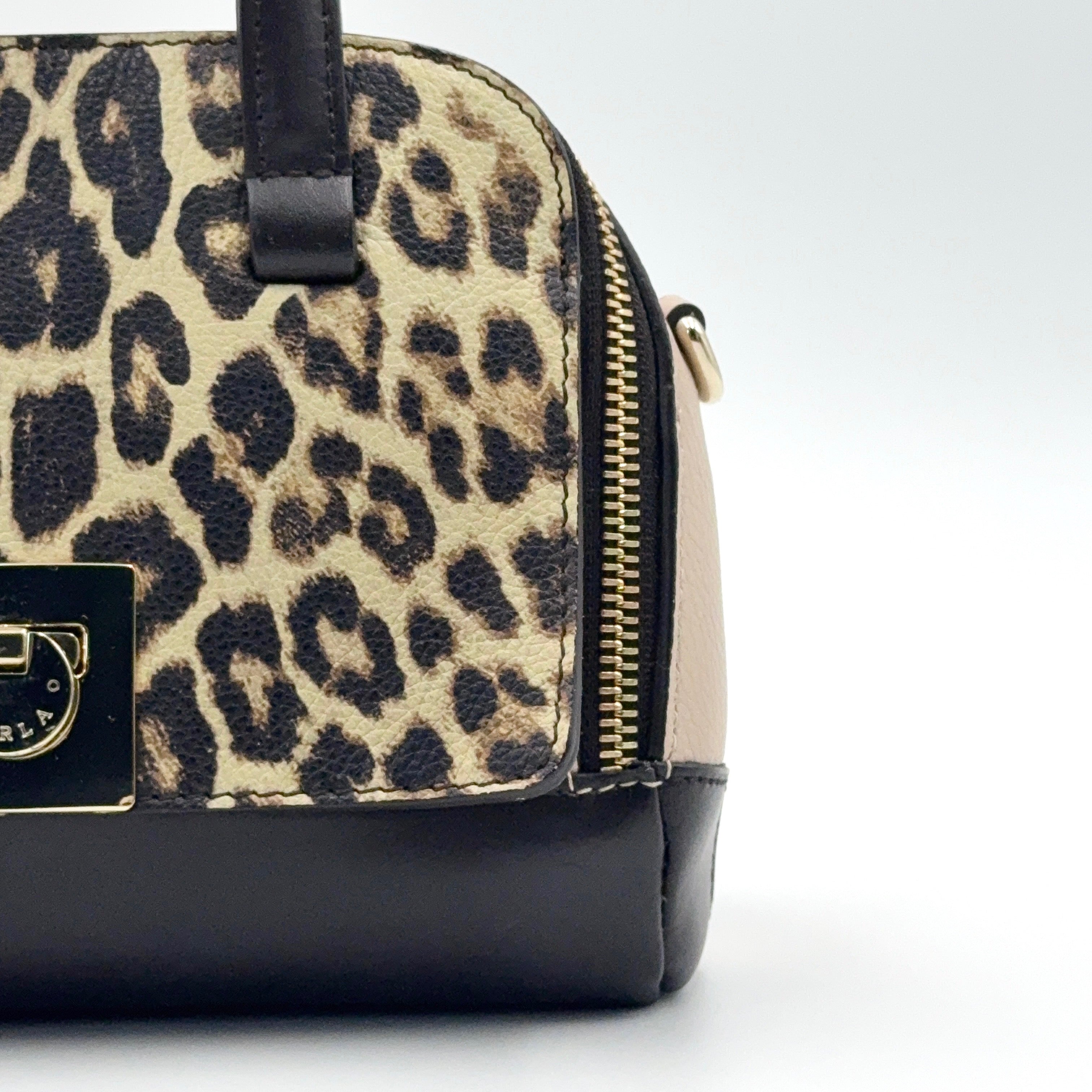 Furla 2Way Leopard Shoulder Bag in black leather with top handles, leopard print front, and detachable strap displayed beside it.