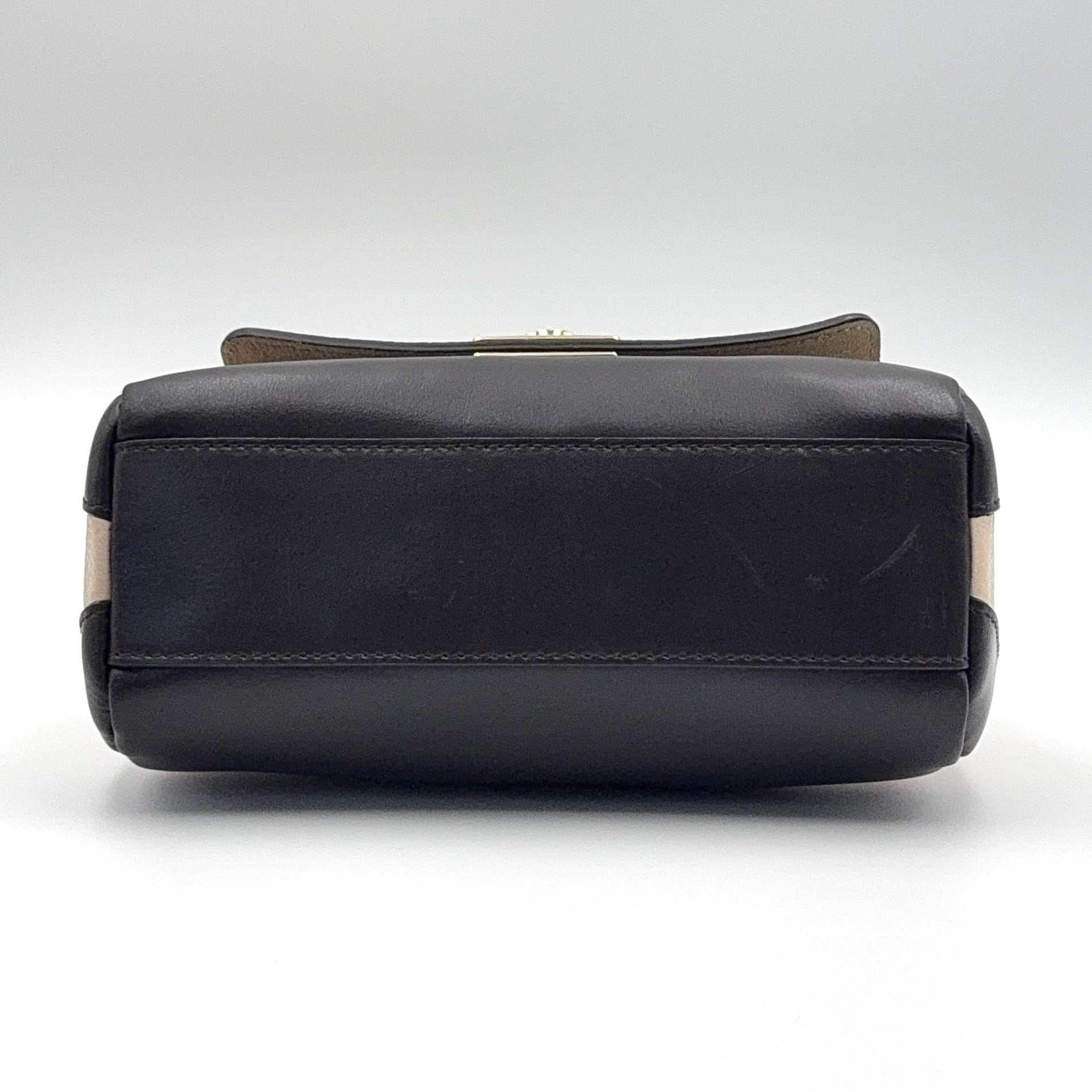 Furla 2Way Leopard Shoulder Bag in black leather with top handles, leopard print front, and detachable strap displayed beside it.