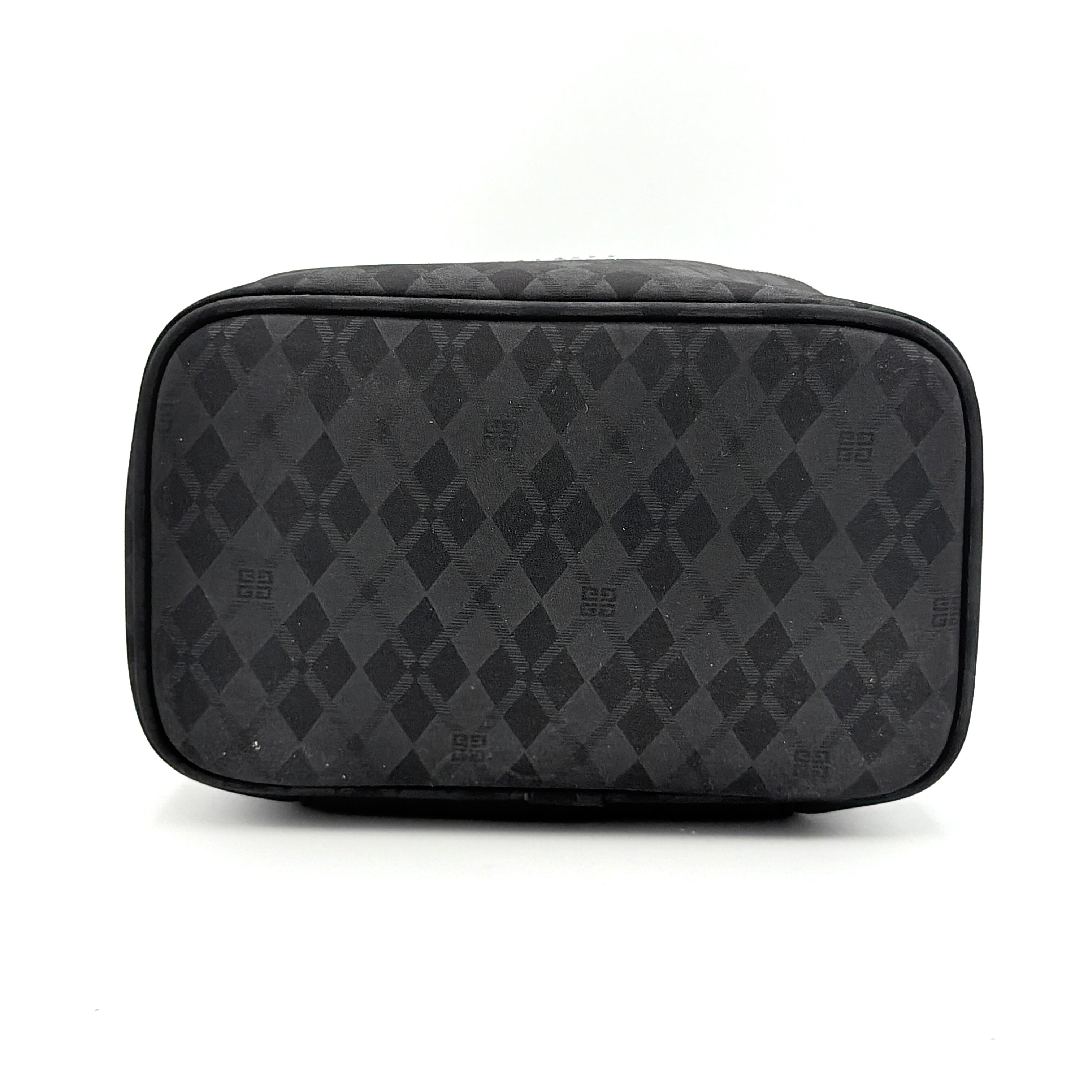 Givenchy vanity bag in black with rhinestone logo, geometric pattern, and top handle, shown from the front.