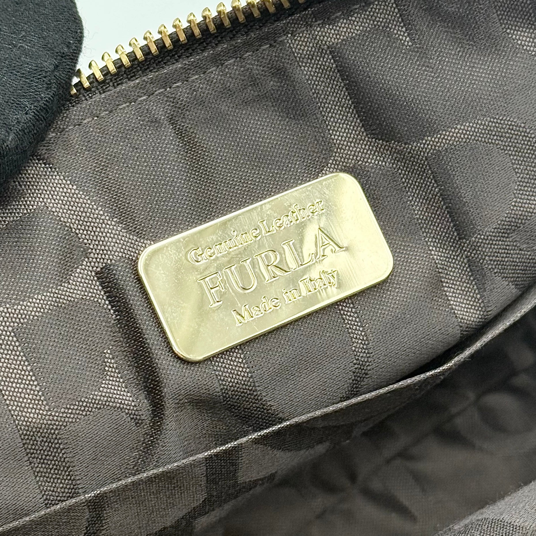 Furla 2Way Leopard Shoulder Bag in black leather with top handles, leopard print front, and detachable strap displayed beside it.