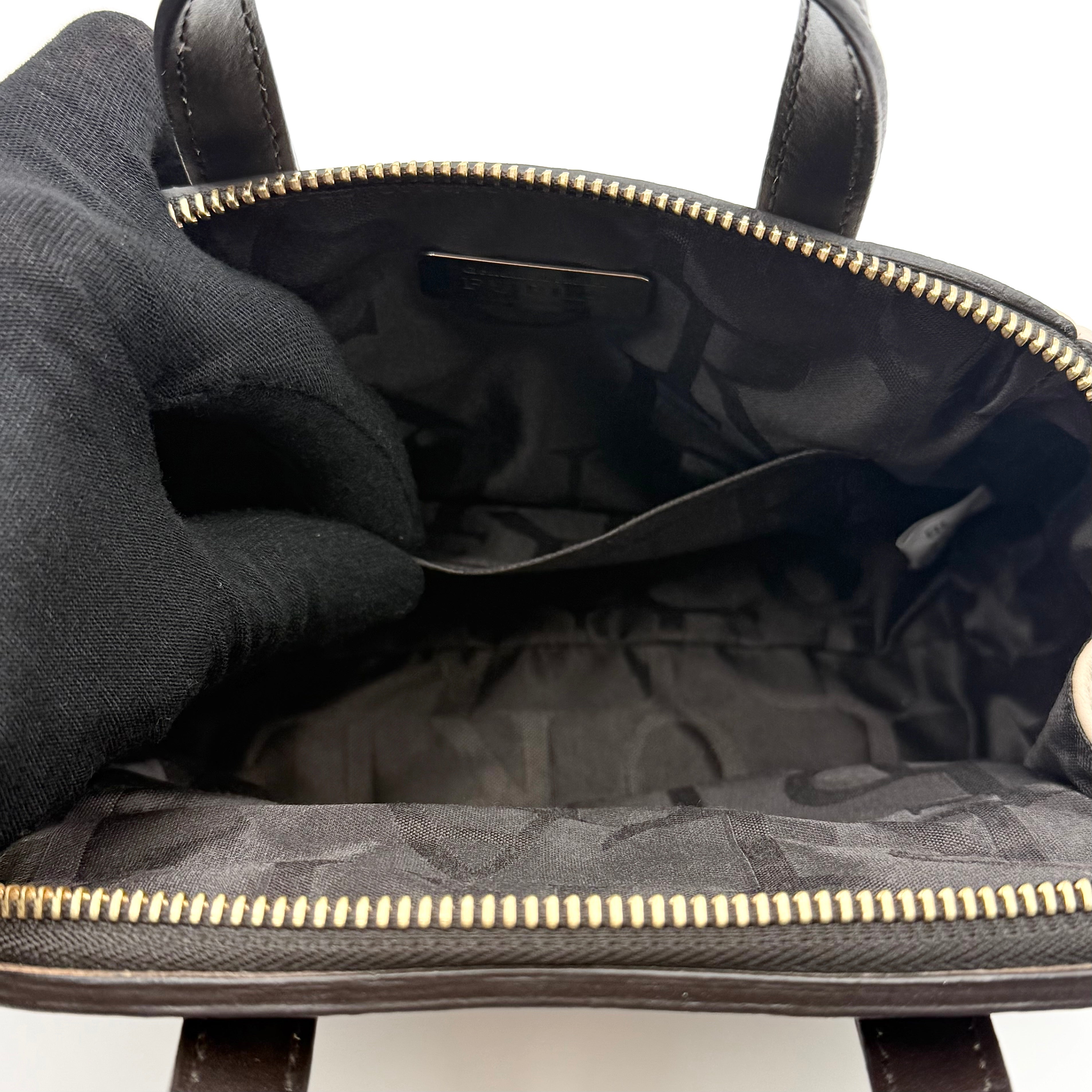 Furla 2Way Leopard Shoulder Bag in black leather with top handles, leopard print front, and detachable strap displayed beside it.