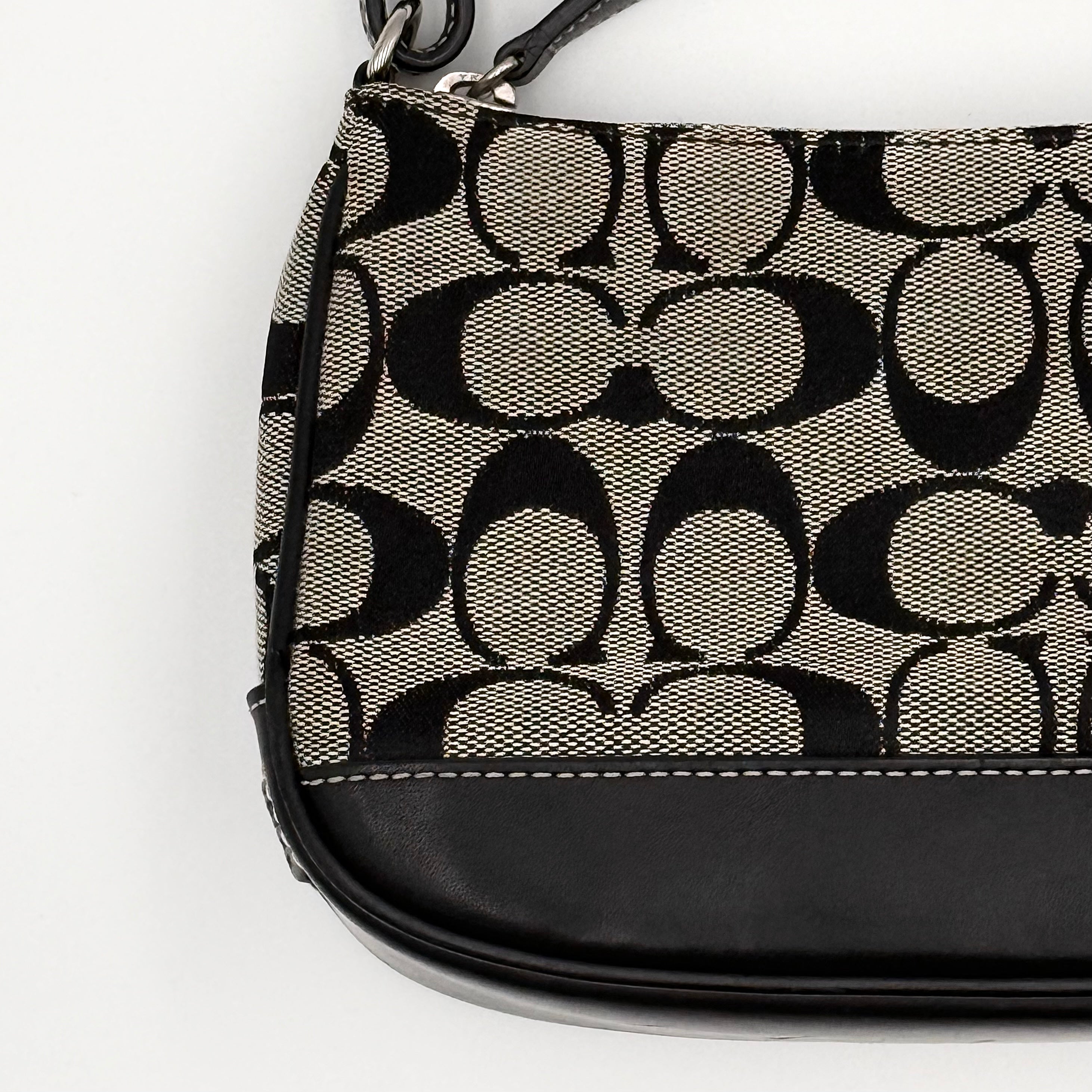Coach Y2K Demi Shoulder Bag in black and grey signature jacquard with black leather trim and detachable Coach tag.