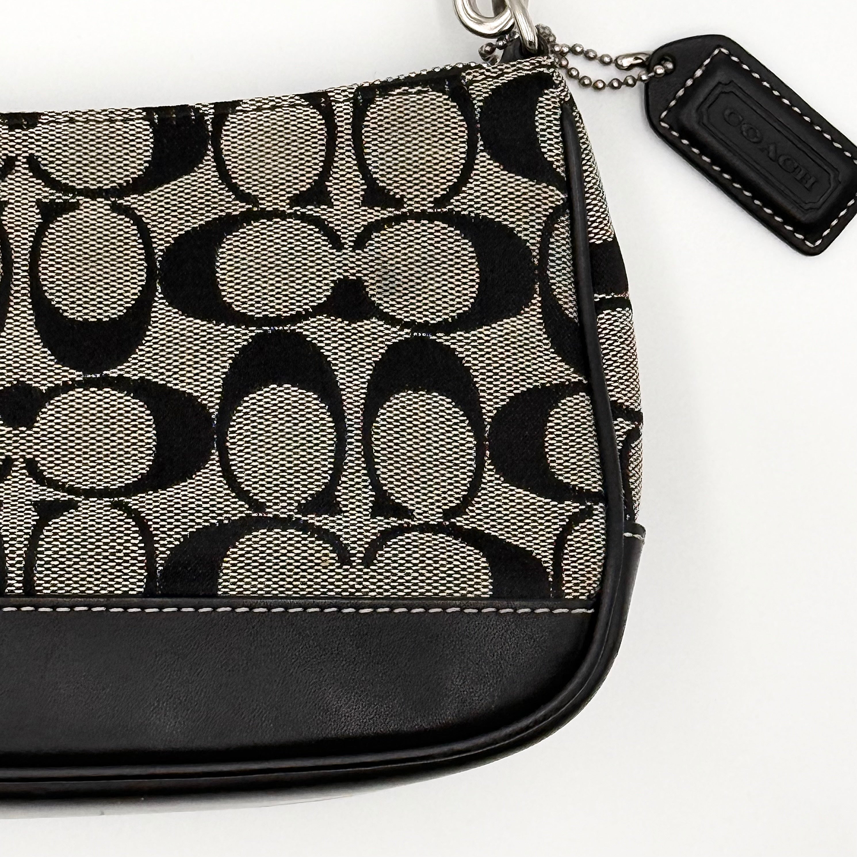 Coach Y2K Demi Shoulder Bag in black and grey signature jacquard with black leather trim and detachable Coach tag.