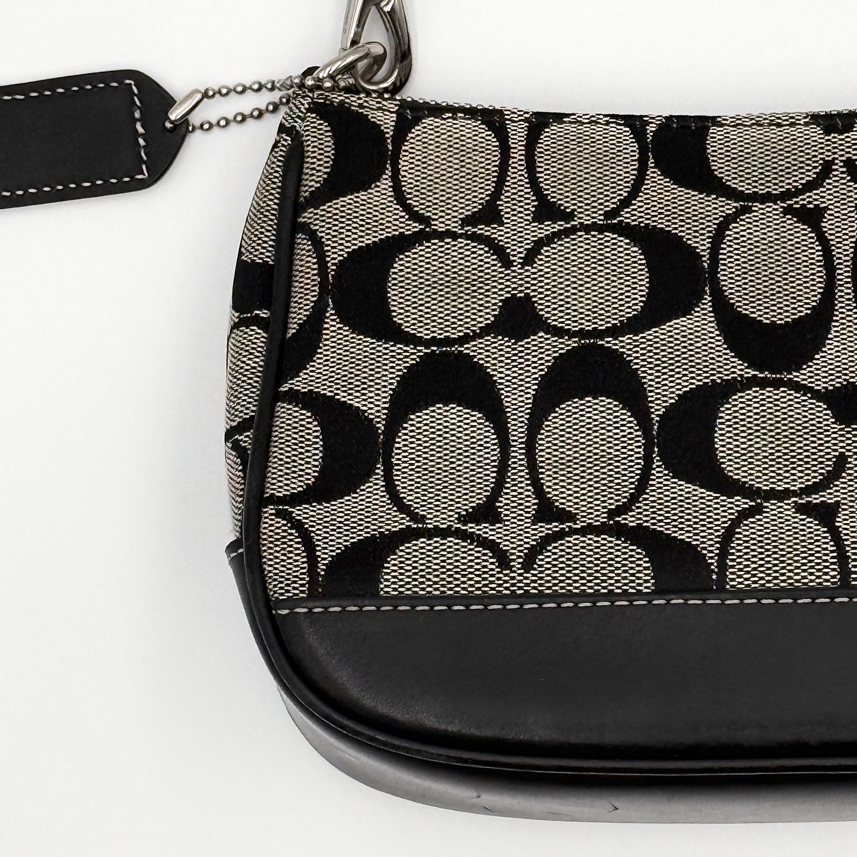 Coach Y2K Demi Shoulder Bag in black and grey signature jacquard with black leather trim and detachable Coach tag.