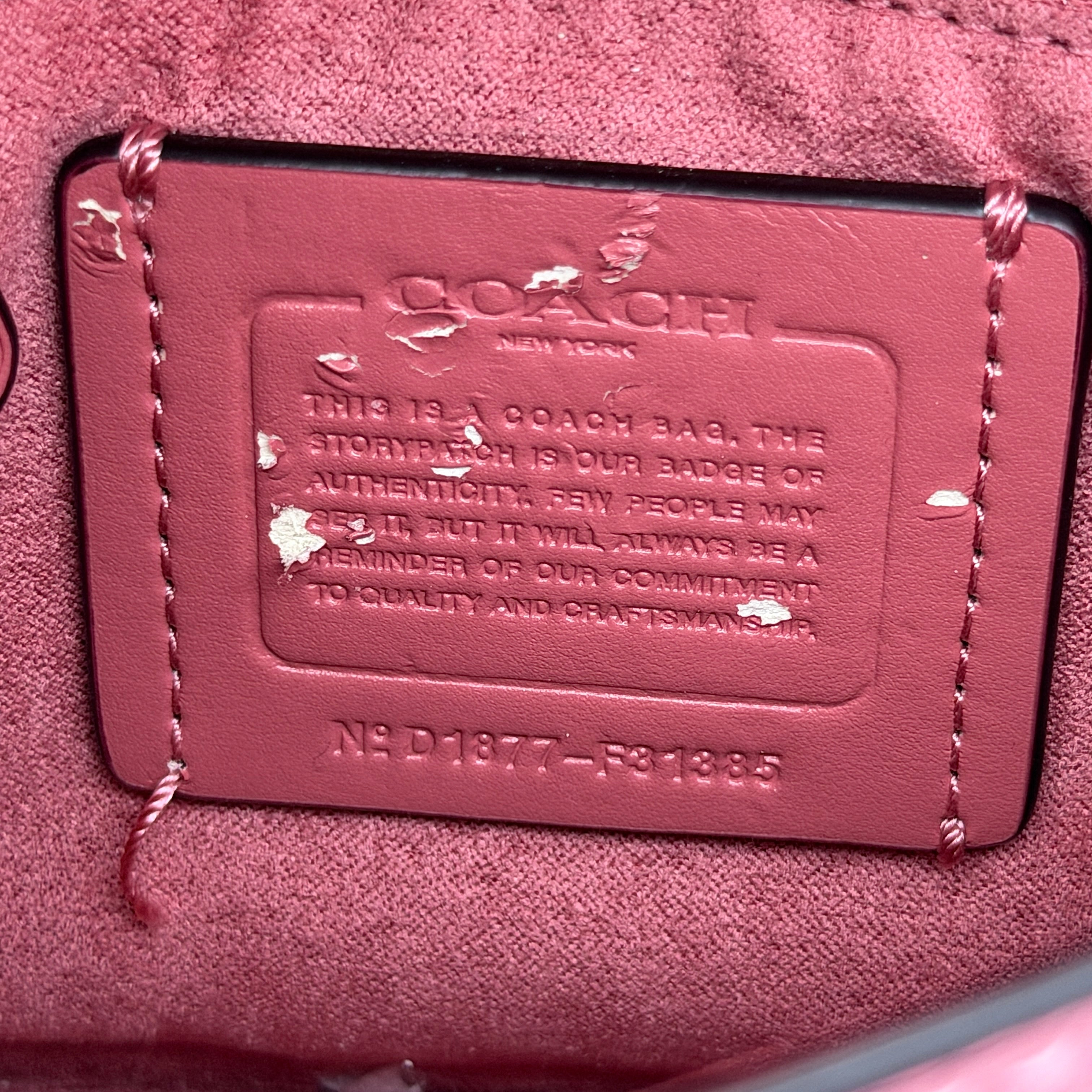 Coach Bowery Turnlock shoulder bag in pink saffiano leather with a gold-tone chain strap and signature Coach hangtag.