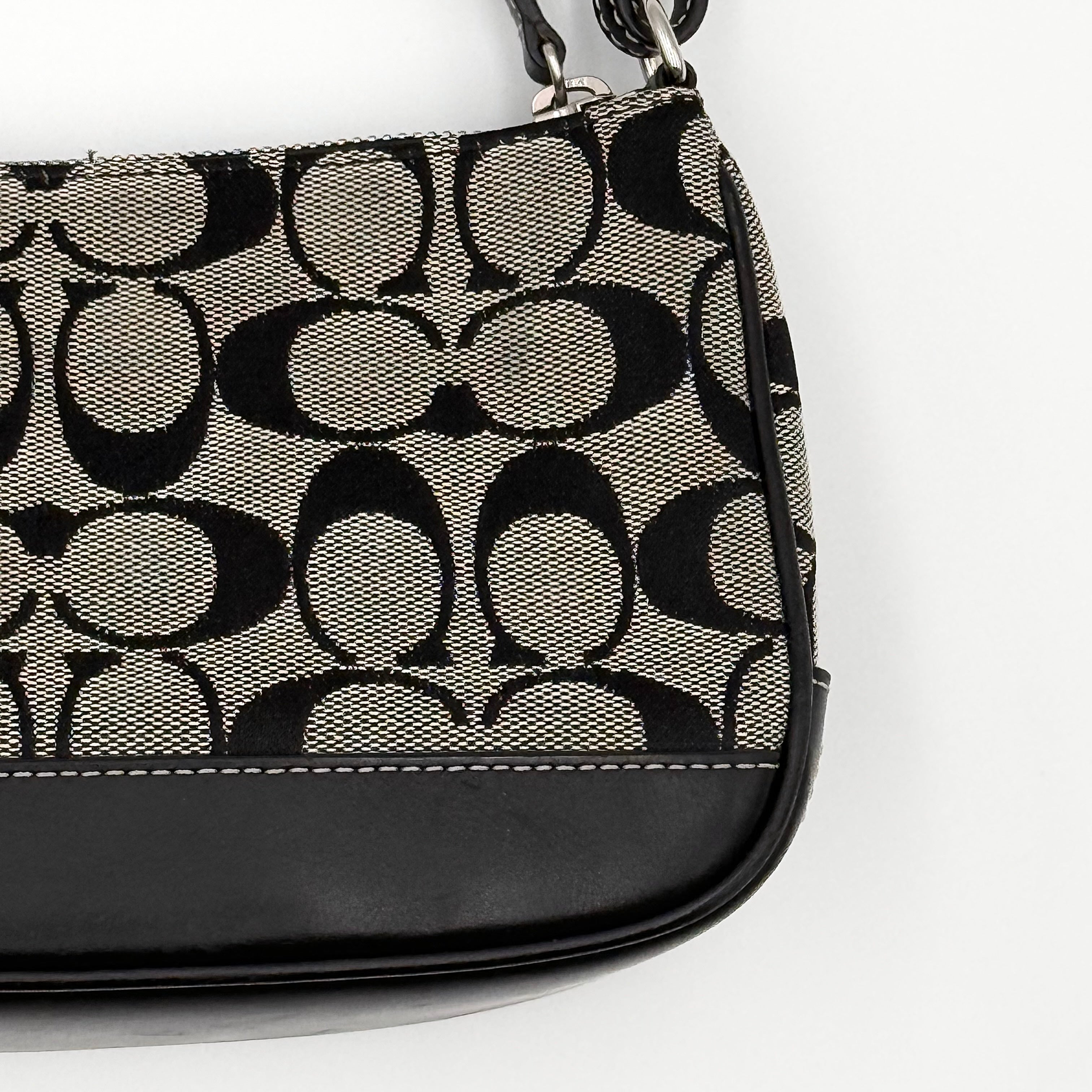 Coach Y2K Demi Shoulder Bag in black and grey signature jacquard with black leather trim and detachable Coach tag.