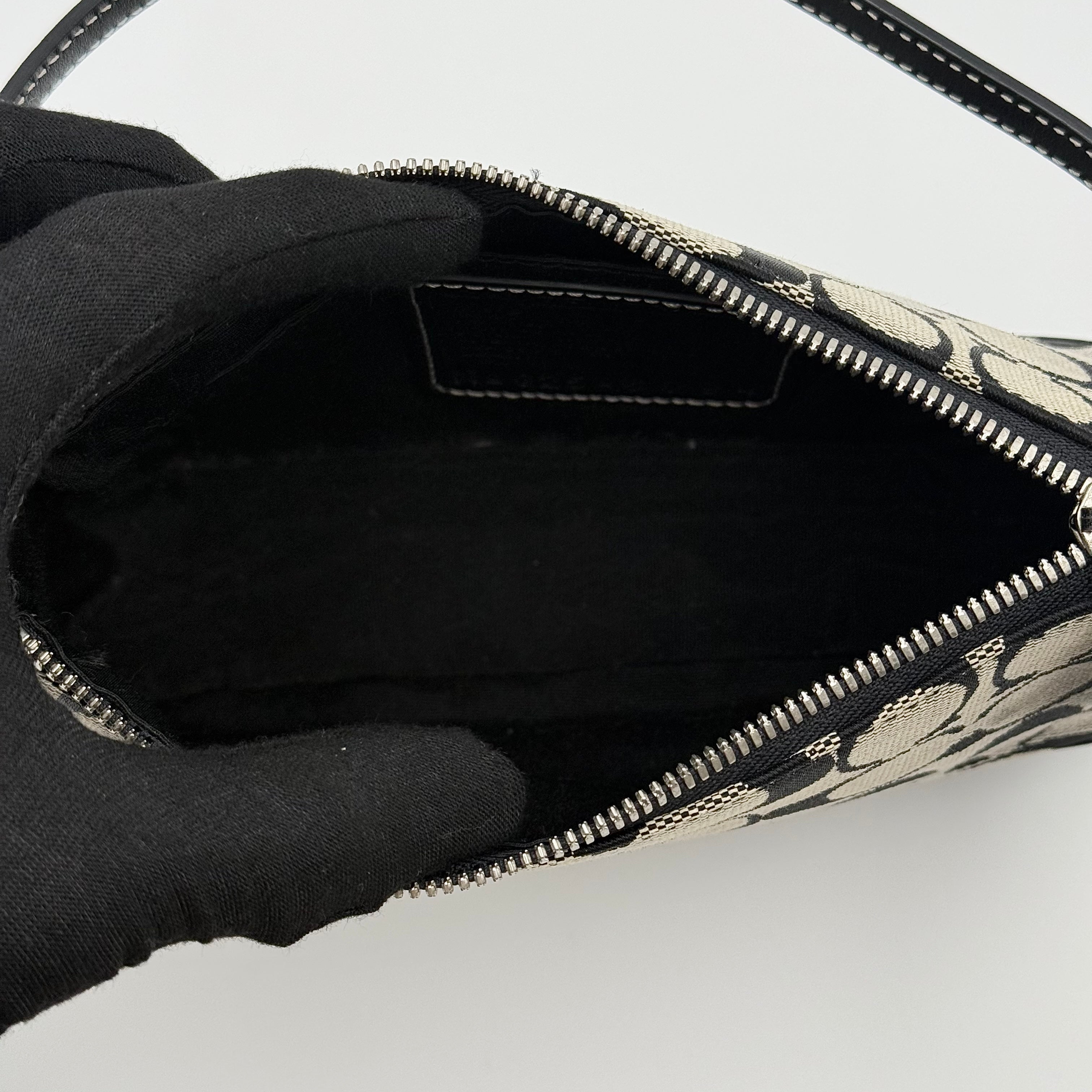 Coach Y2K Demi Shoulder Bag in black and grey signature jacquard with black leather trim and detachable Coach tag.
