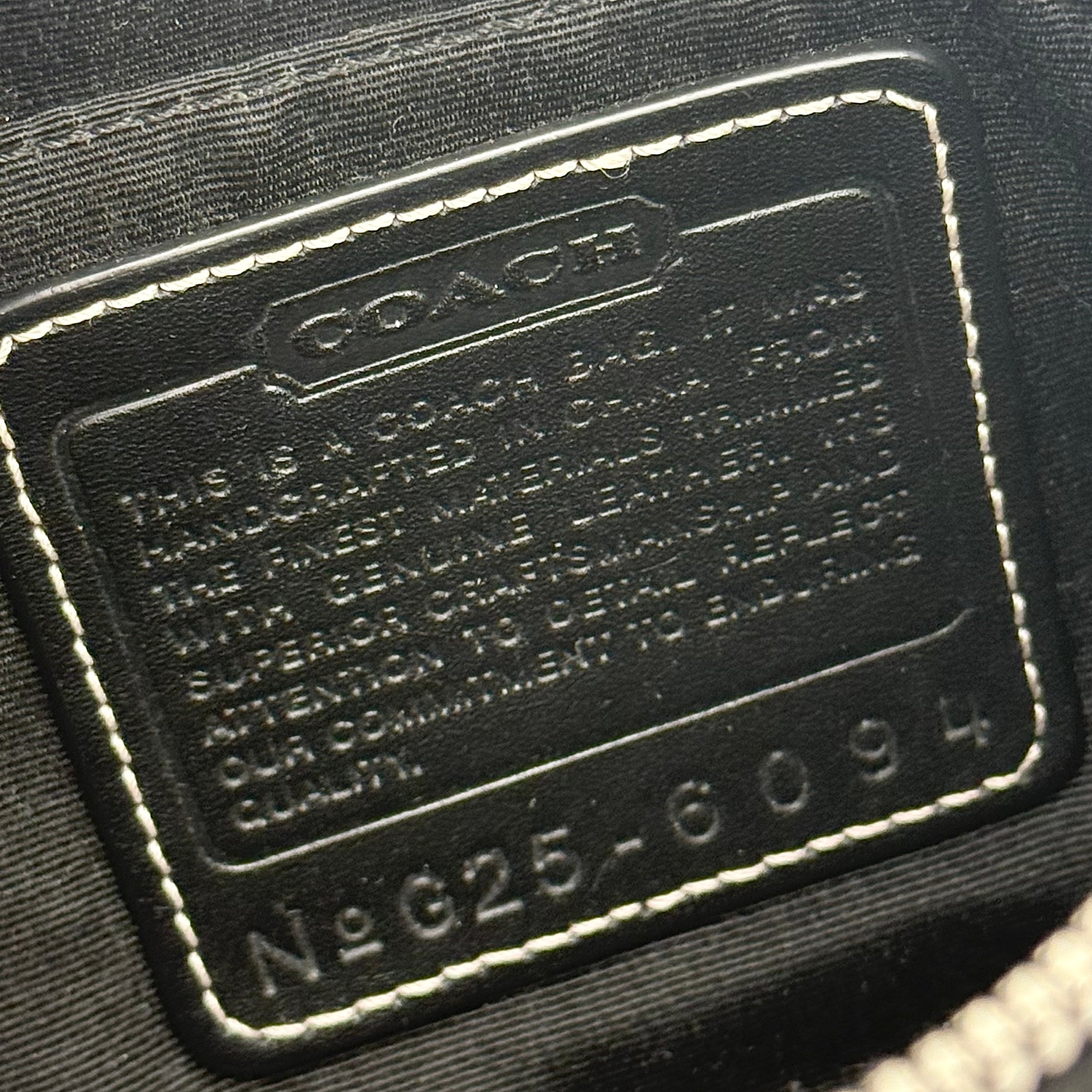 Coach Y2K Demi Shoulder Bag in black and grey signature jacquard with black leather trim and detachable Coach tag.