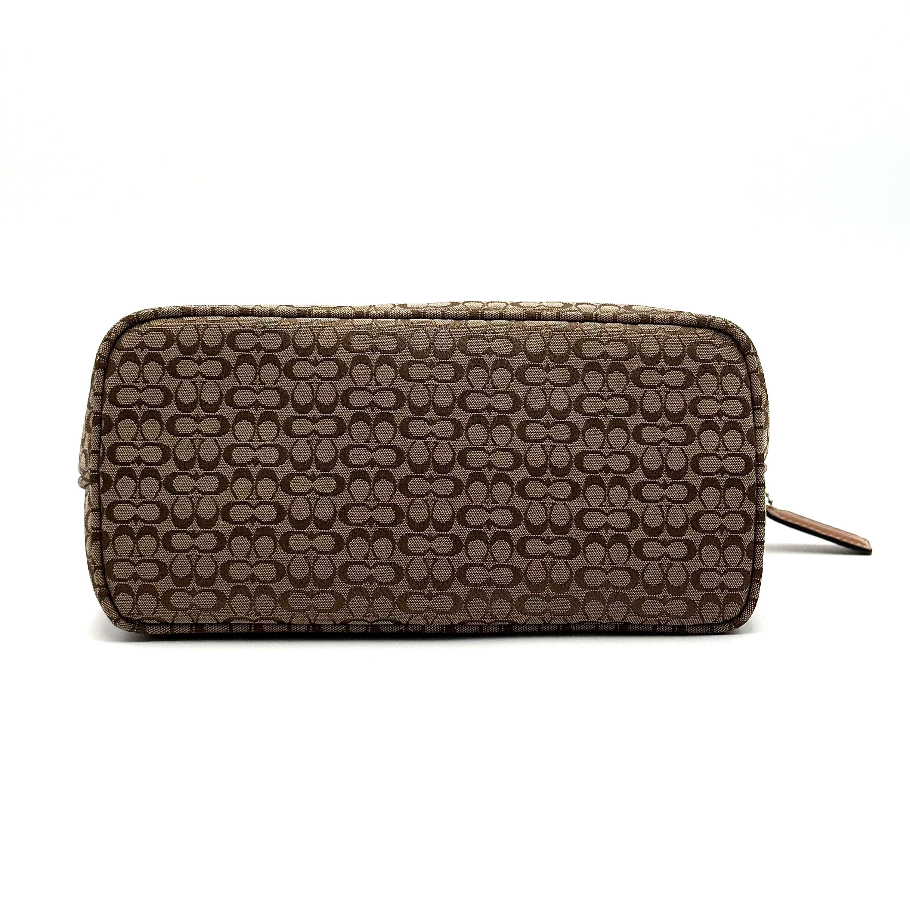 Coach signature beige jacquard hobo shoulder bag with tan leather trim and silver-tone hardware.