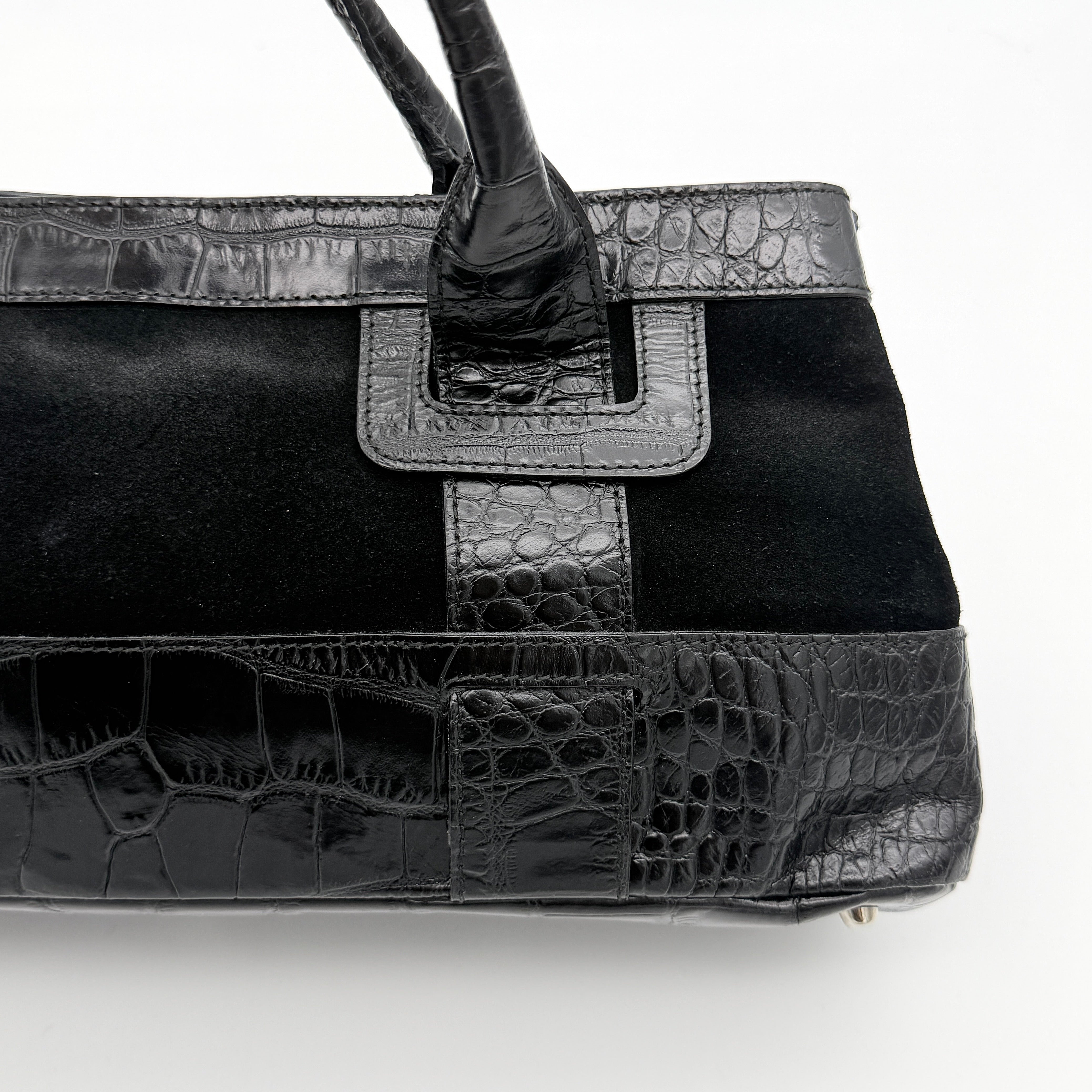 Furla croc-embossed black leather shoulder bag with suede panels and double handles, displayed against a white background.
