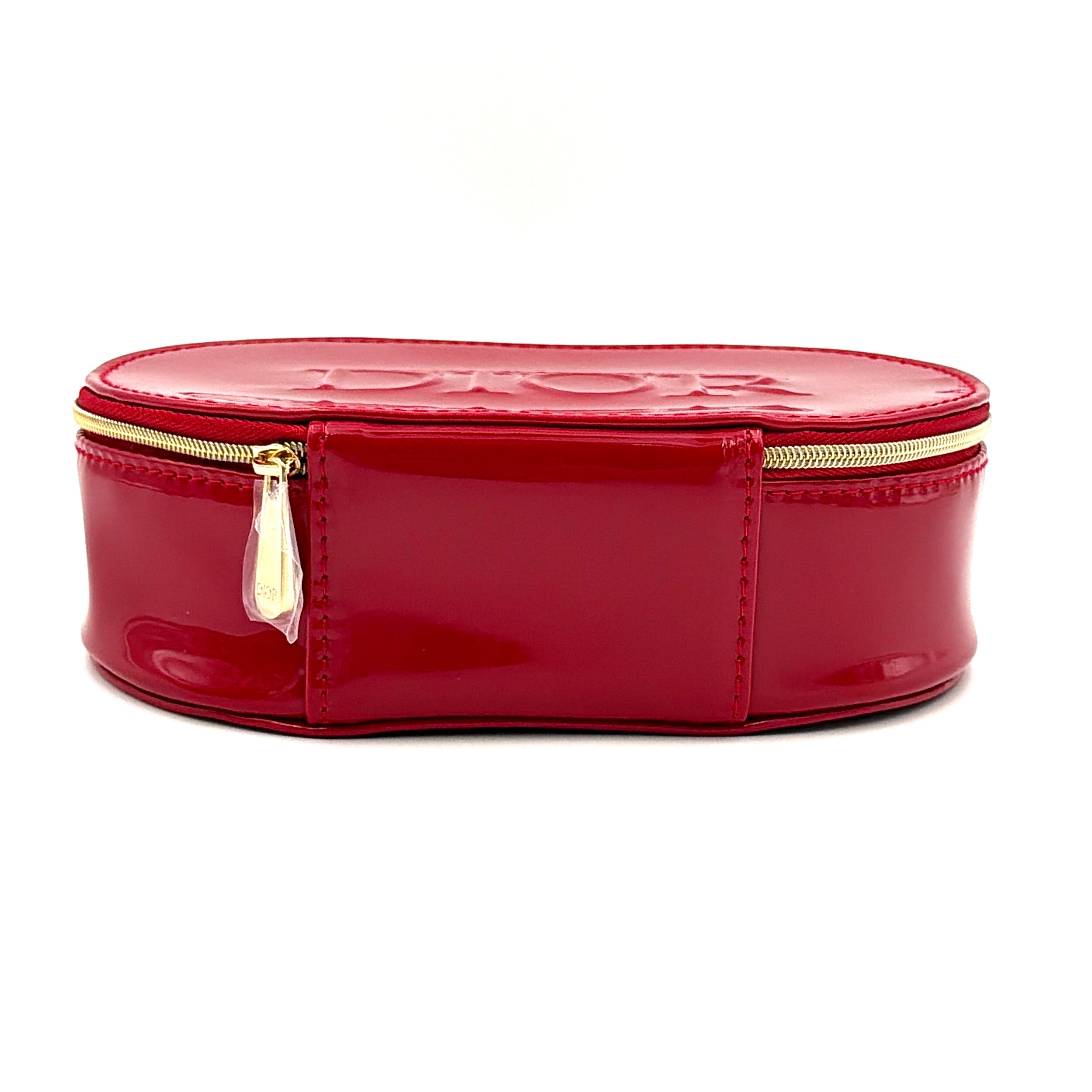 Christian Dior patent leather cosmetic pouch in glossy red with embossed DIOR logo and gold zip hardware.