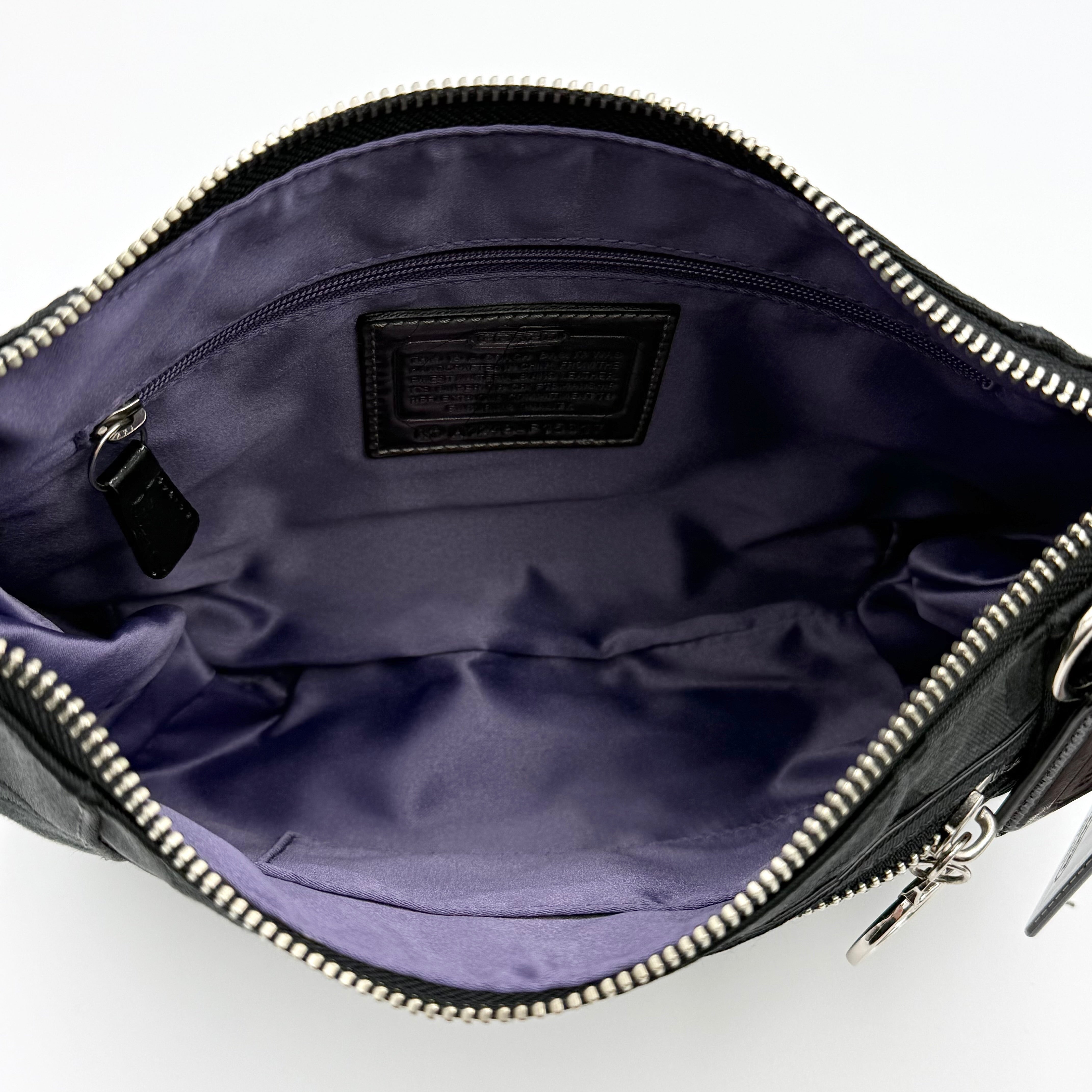 Coach black Signature Poppy Shoulder Bag with silver hardware, Coach tags, and tonal jacquard finish on a white background.