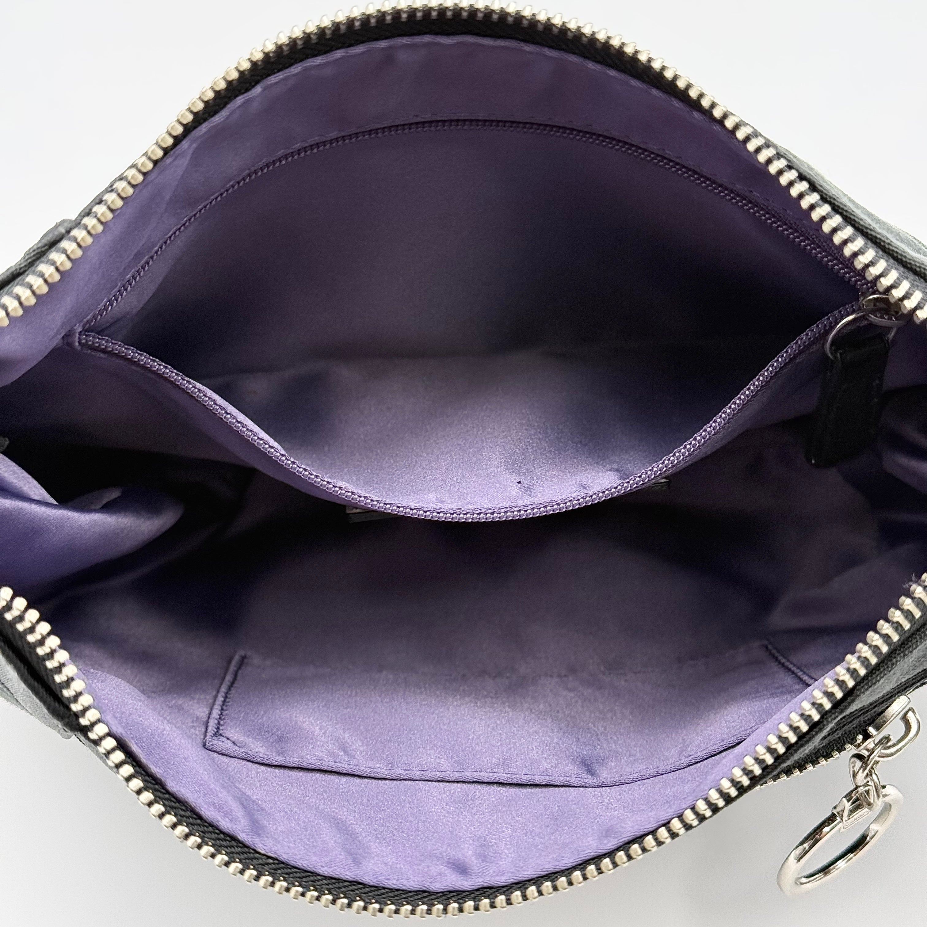Coach black Signature Poppy Shoulder Bag with silver hardware, Coach tags, and tonal jacquard finish on a white background.