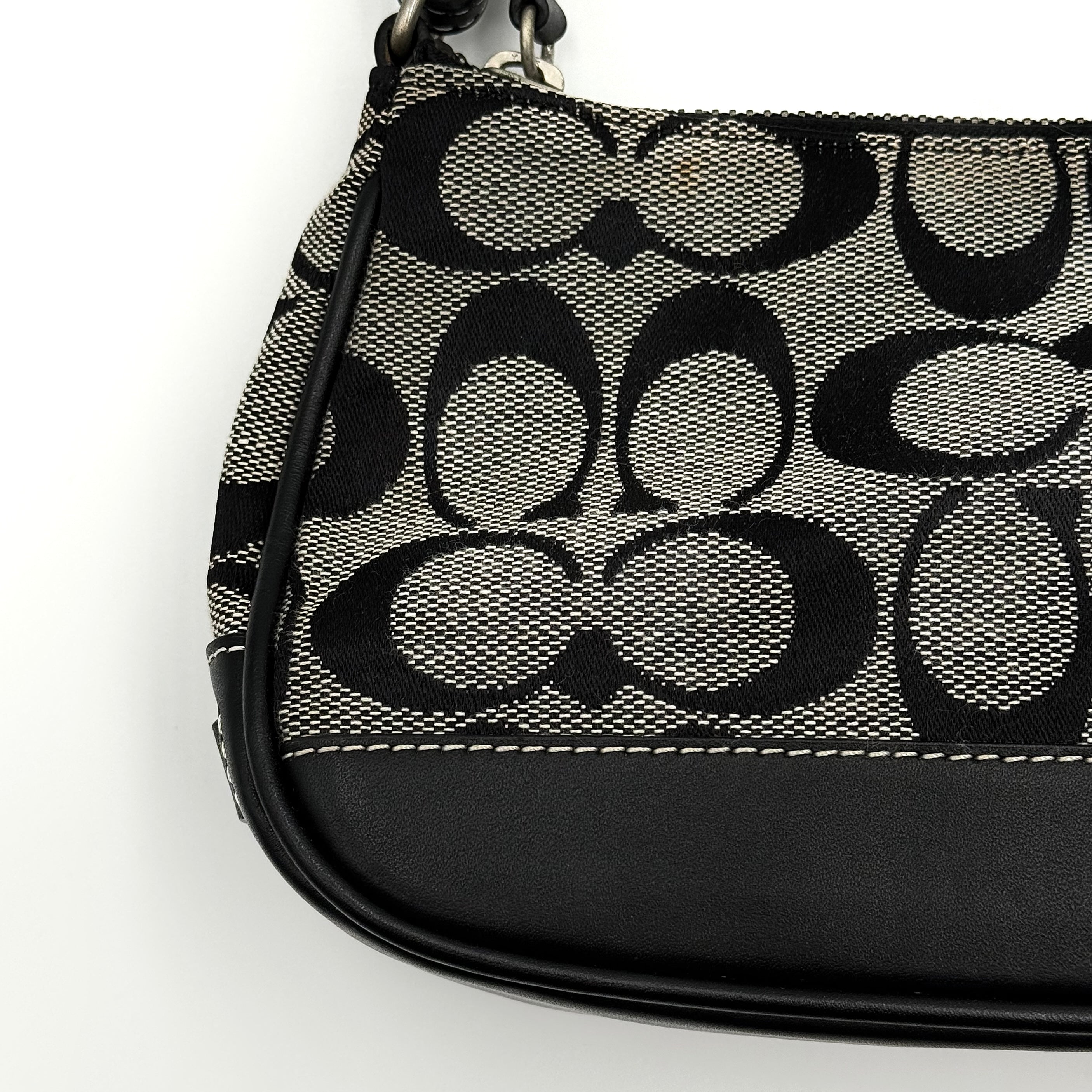 Coach Y2K Demi Shoulder Bag in black and grey signature jacquard with black leather trim and silver hardware.