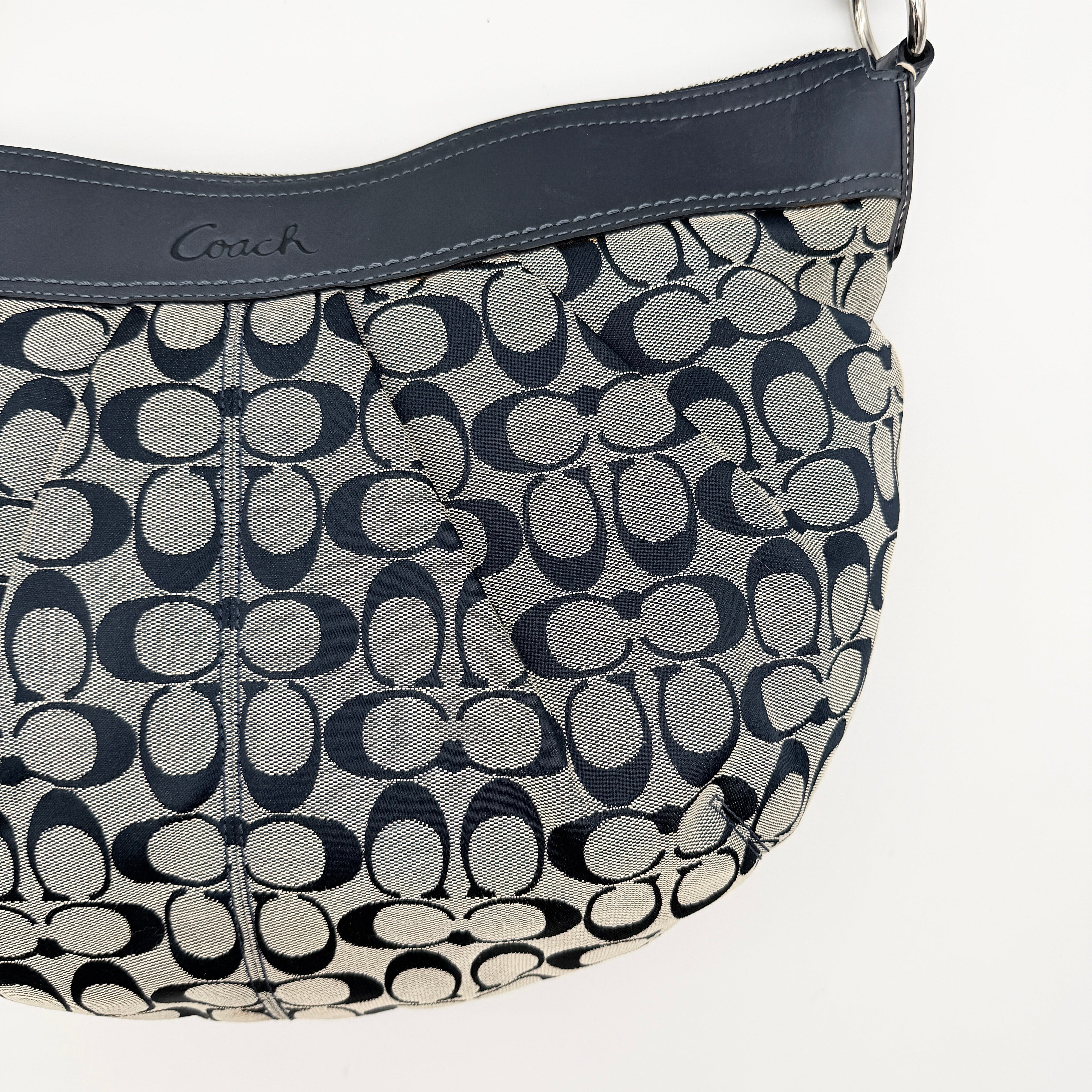 Coach Soho Pleated Hobo Shoulder Bag in black and grey signature jacquard with leather trim and silver hardware.