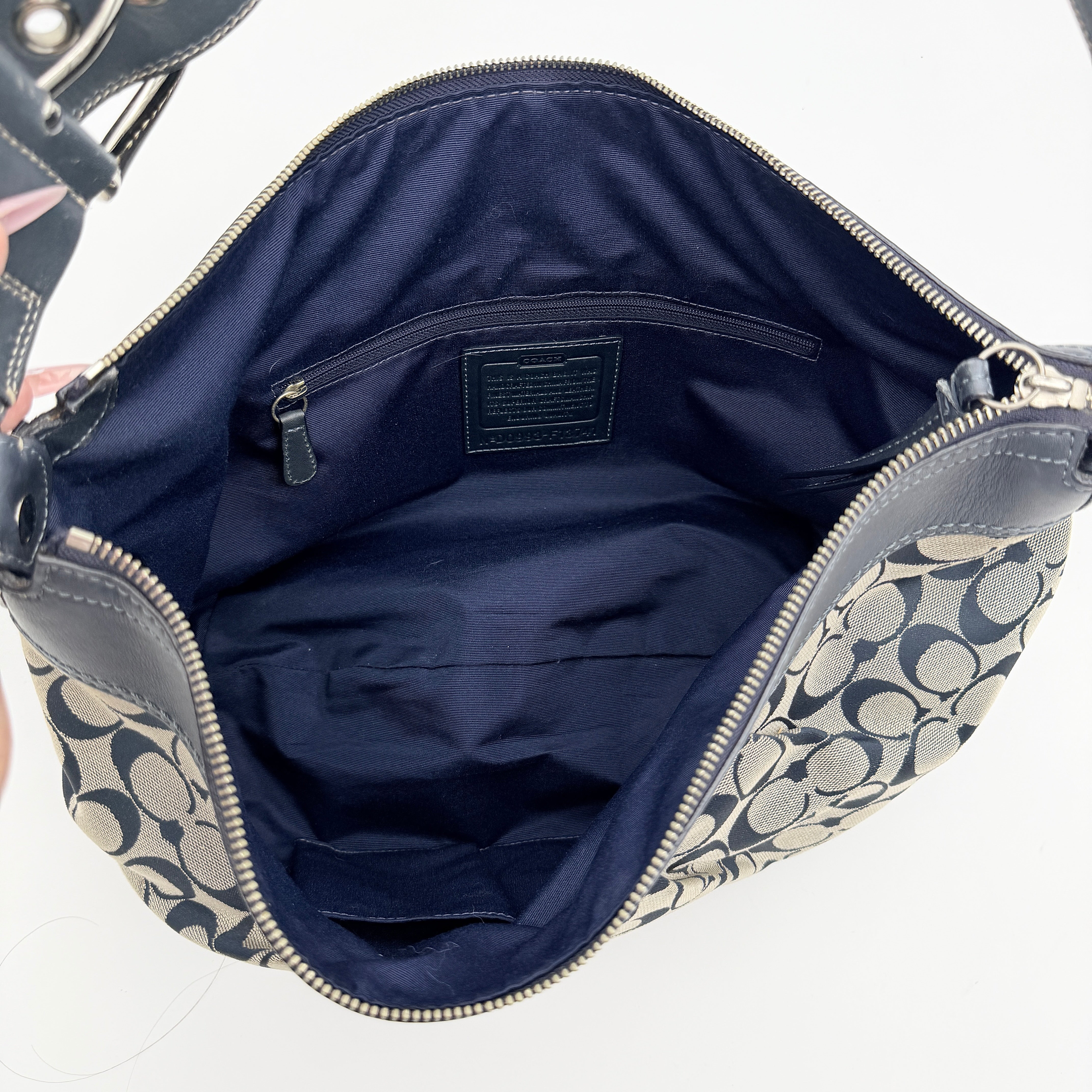 Coach Soho Pleated Hobo Shoulder Bag in black and grey signature jacquard with leather trim and silver hardware.