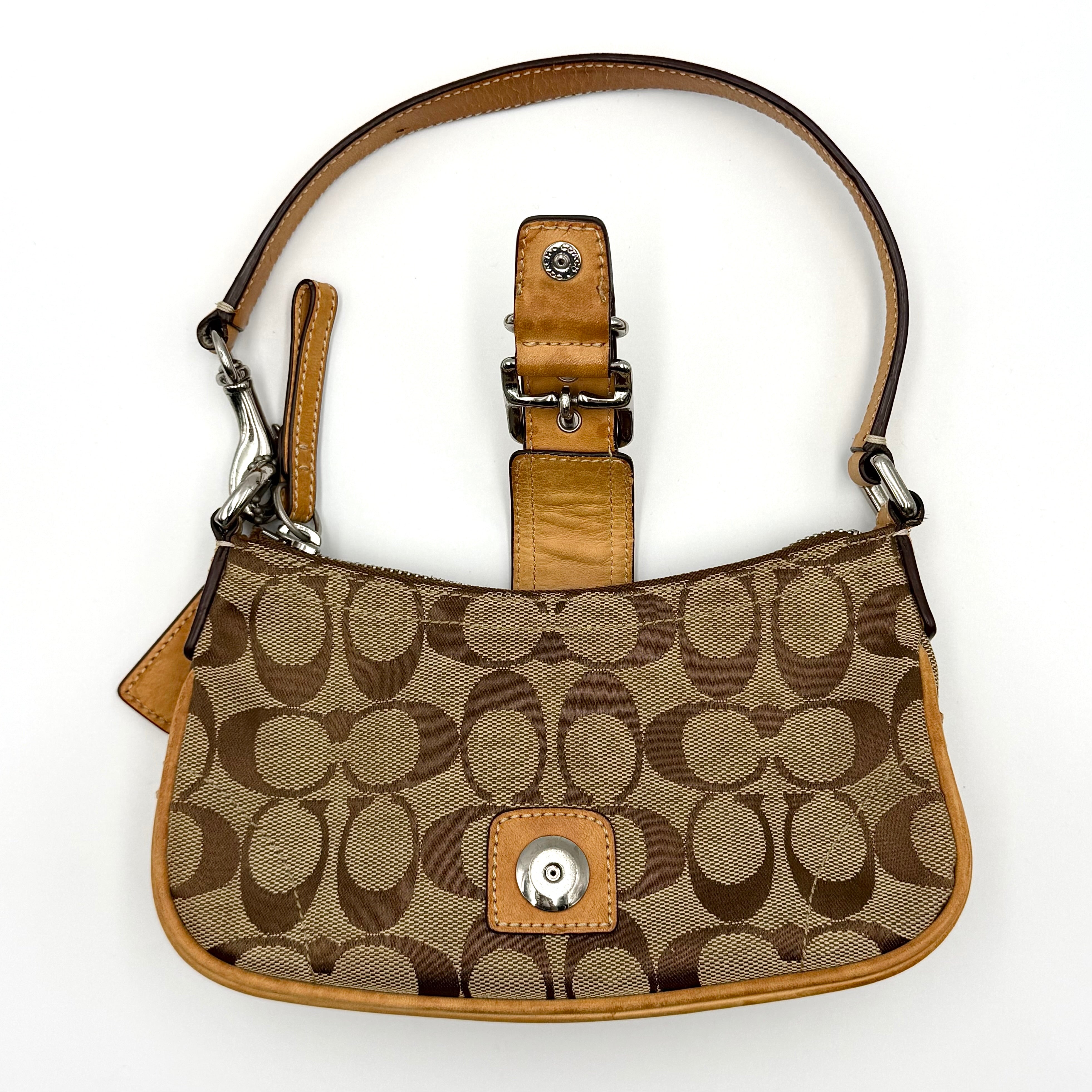Coach Soho Demi shoulder bag in beige and tan monogram canvas with leather trim and buckle detail.