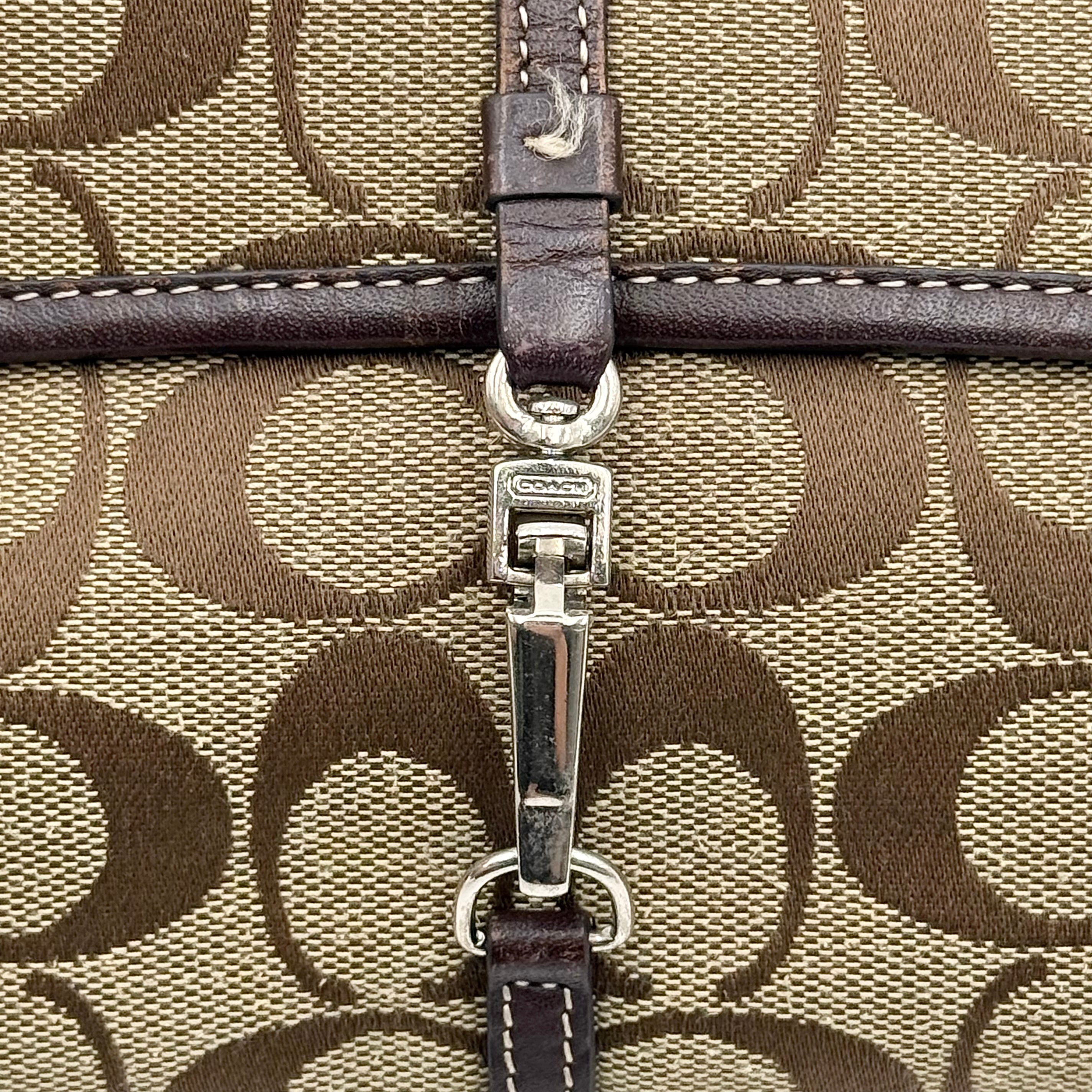 Coach Y2K Demi Clip Baguette in beige and brown canvas with leather trim, featuring signature monogram and shoulder strap.