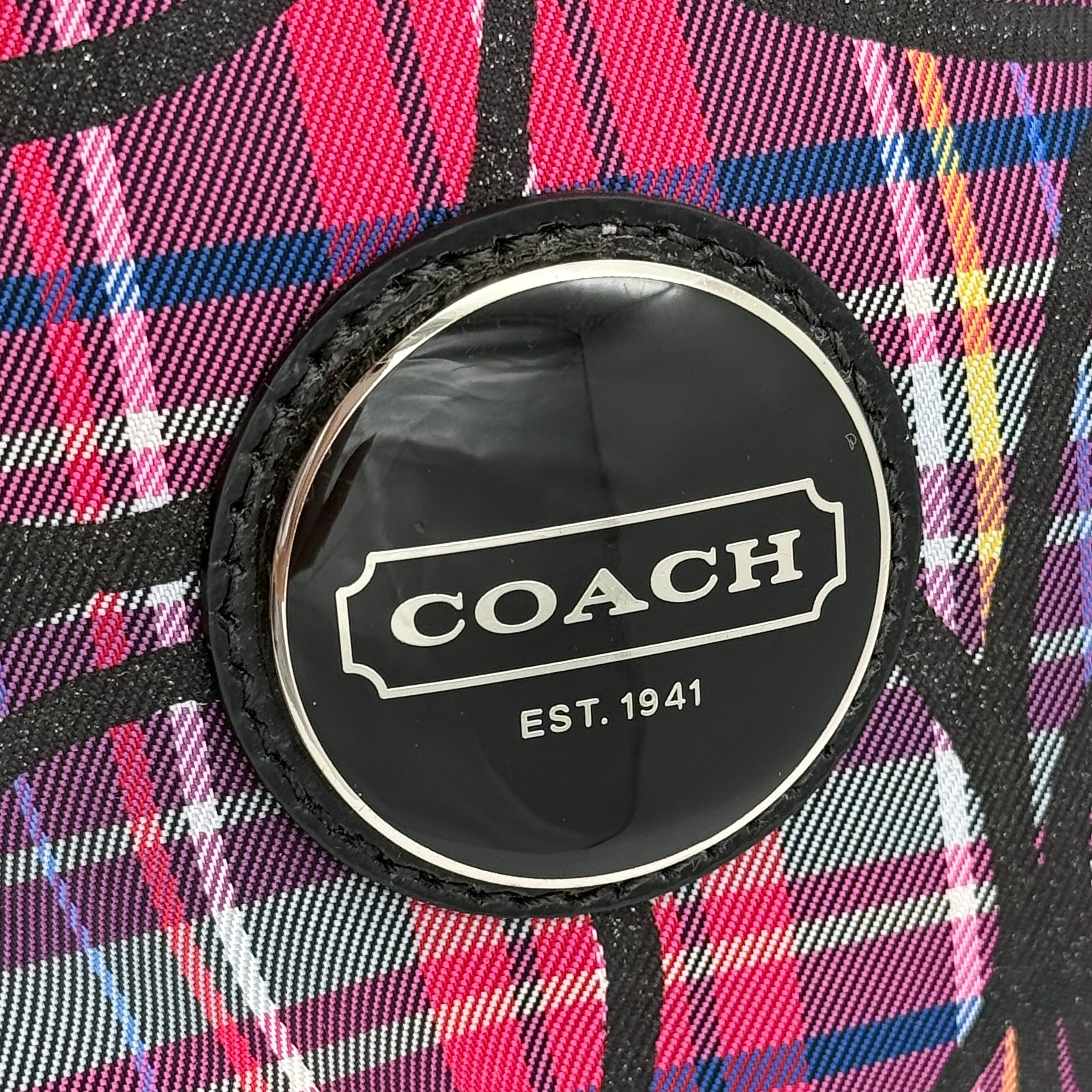 Coach Signature Poppy Tartan Shoulder Bag in vibrant multi plaid with bold black logo print, featuring black patent trim and silver hardware.