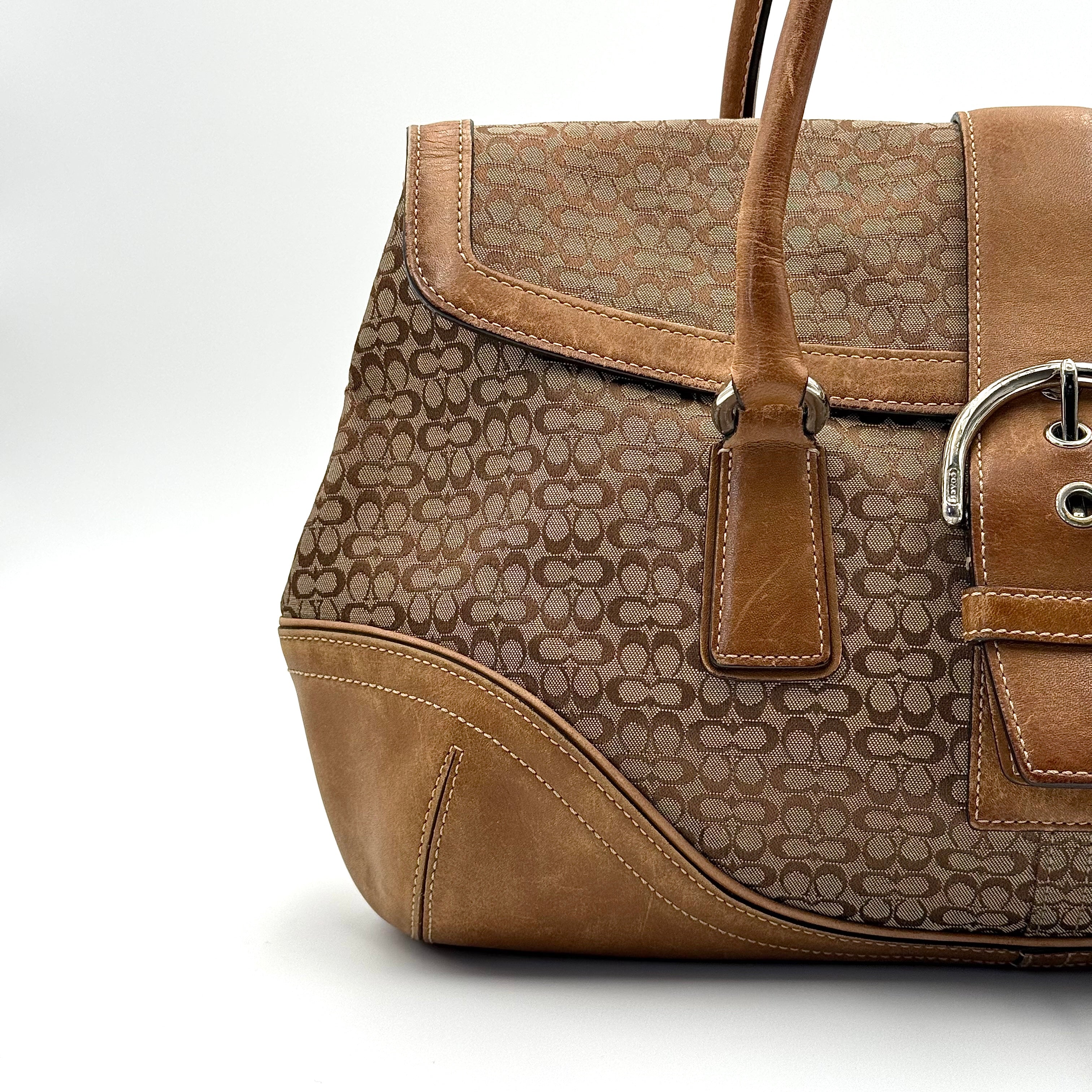 Front-facing view of the Coach Y2K Signature Soho Shoulder Bag in beige and tan jacquard with leather trim.