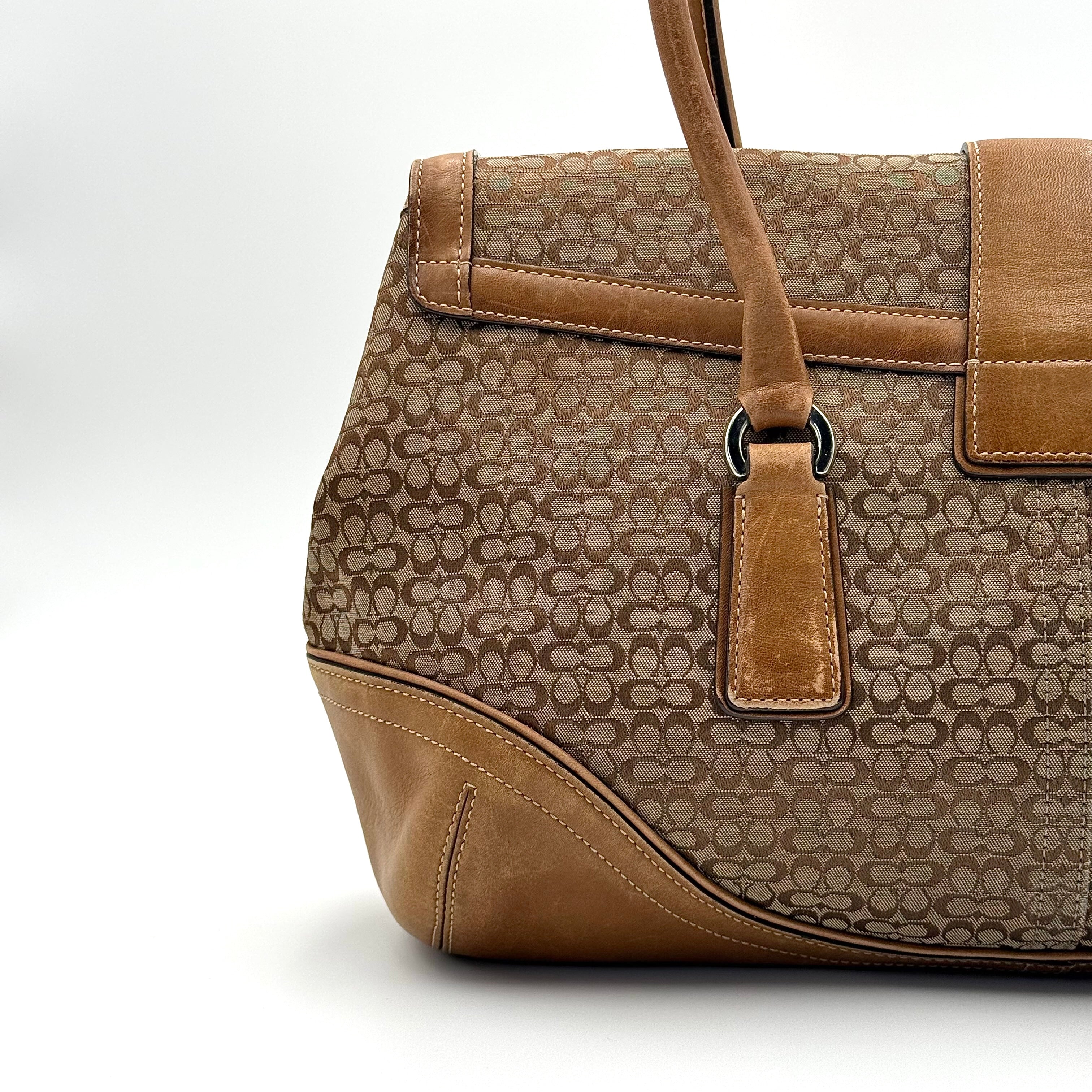 Front-facing view of the Coach Y2K Signature Soho Shoulder Bag in beige and tan jacquard with leather trim.