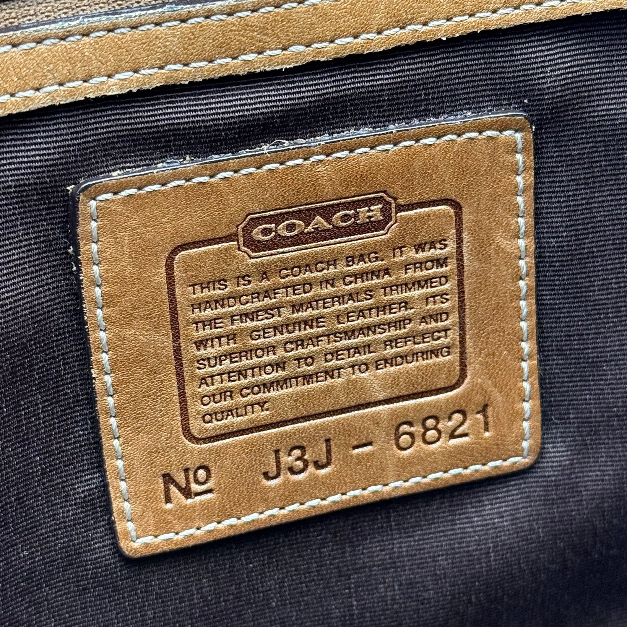 Front-facing view of the Coach Y2K Signature Soho Shoulder Bag in beige and tan jacquard with leather trim.