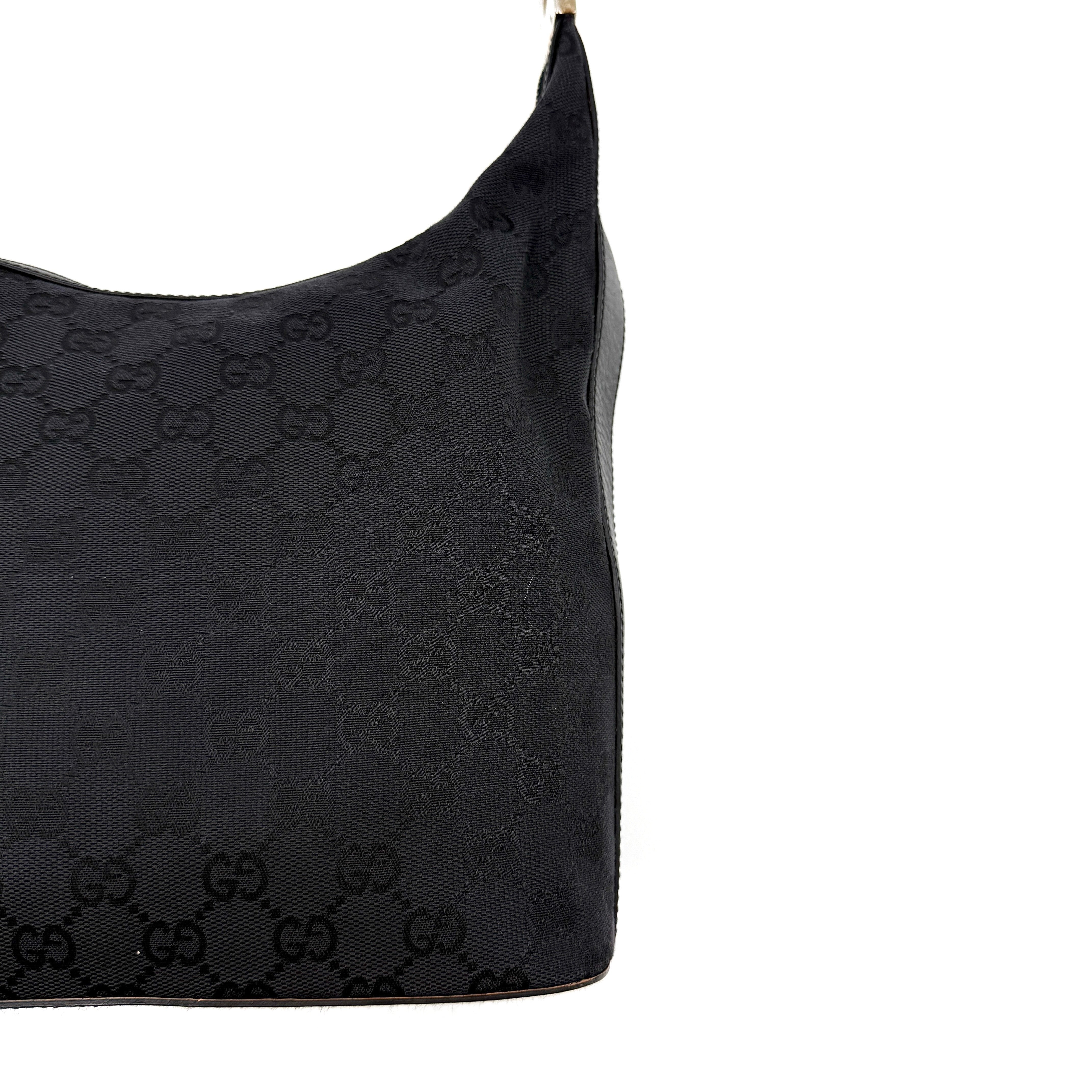 Gucci GG Monogram Hobo Shoulder Bag in black canvas with tonal GG logo pattern, silver-tone hardware and a single top handle.
