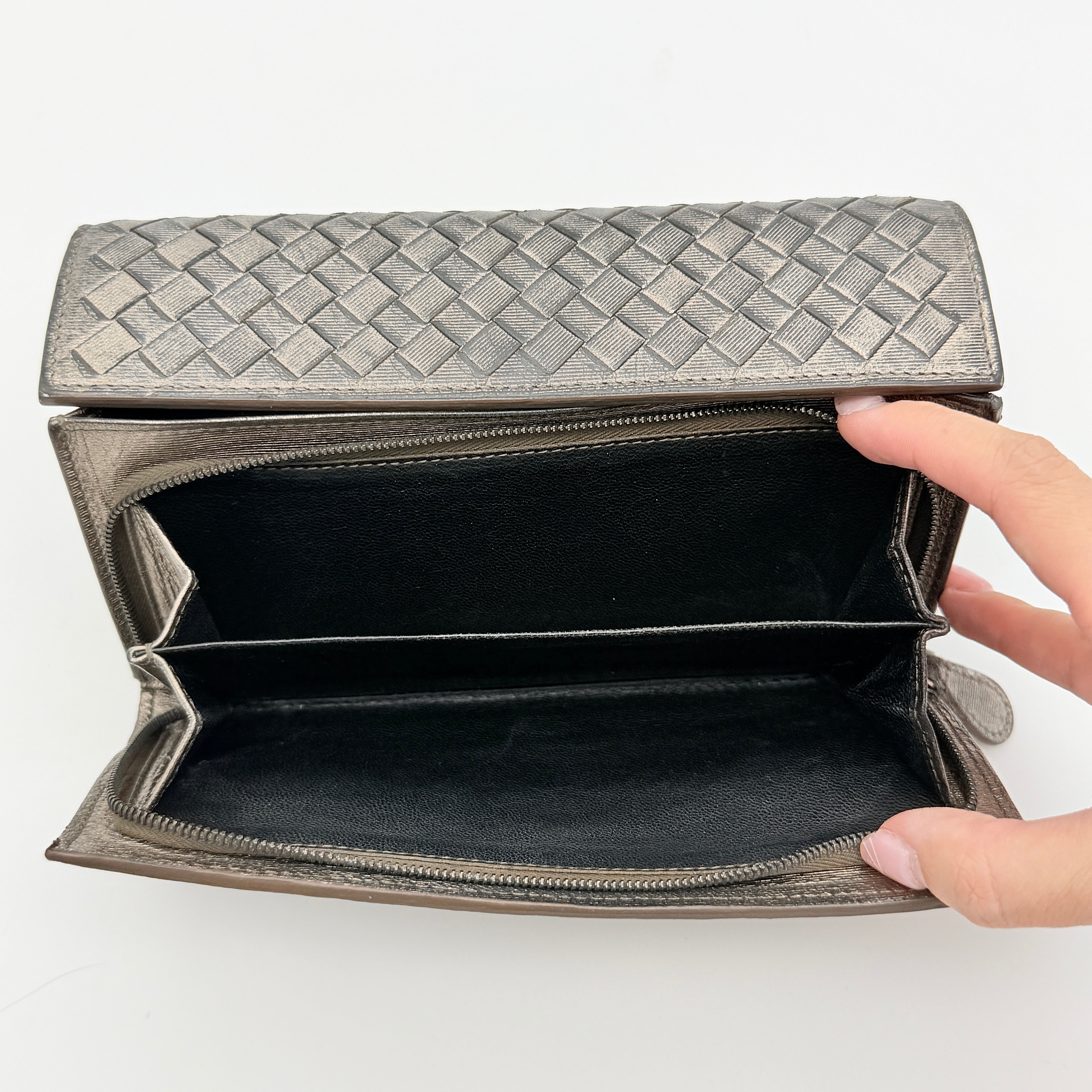 Bottega Veneta Intrecciato Flap Continental Long Wallet in metallic grey with woven leather finish, shown closed on a white background.