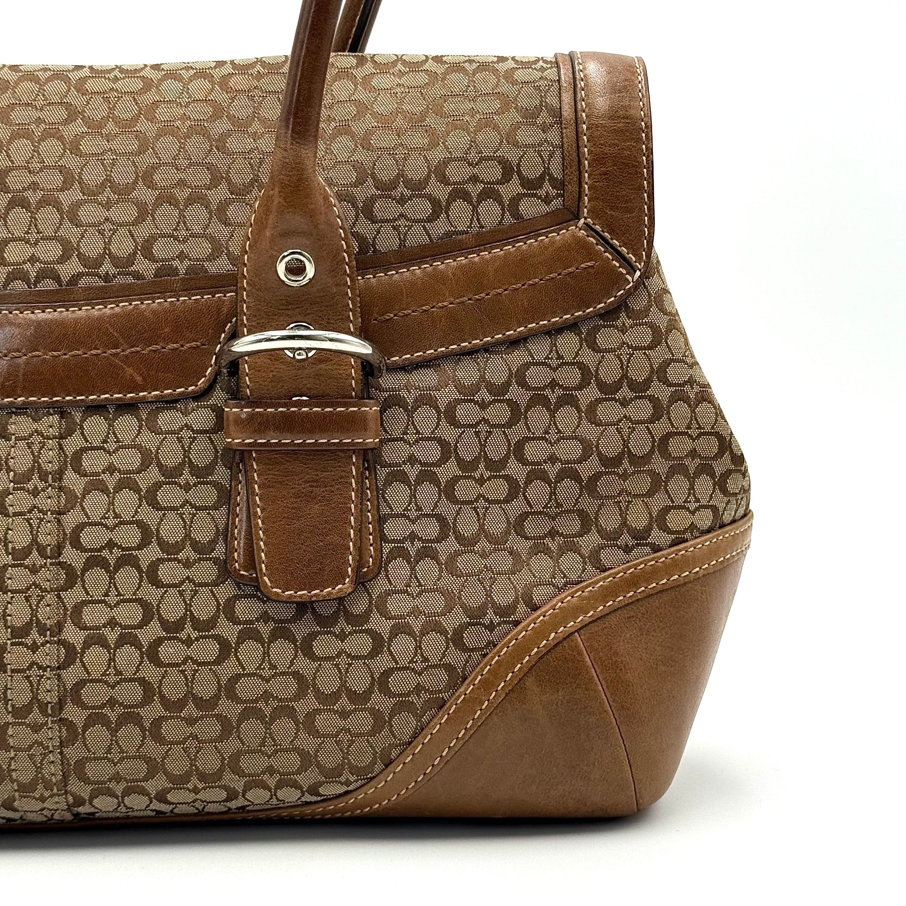 Coach Soho Hampton satchel in beige jacquard canvas with tan leather trim and rolled handles shown against a white background.