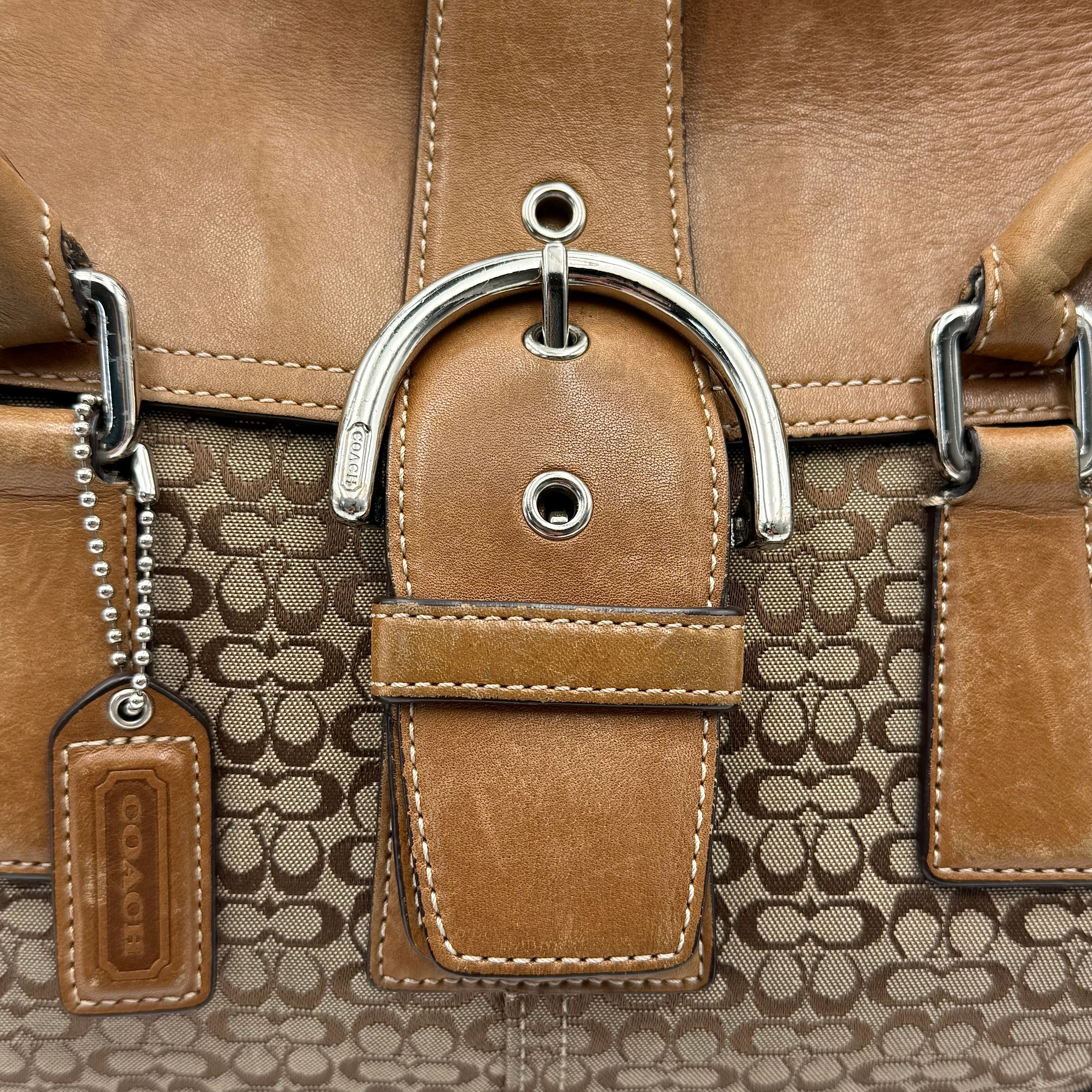 Coach Signature Soho shoulder bag in beige and tan canvas with leather trim and silver buckle.