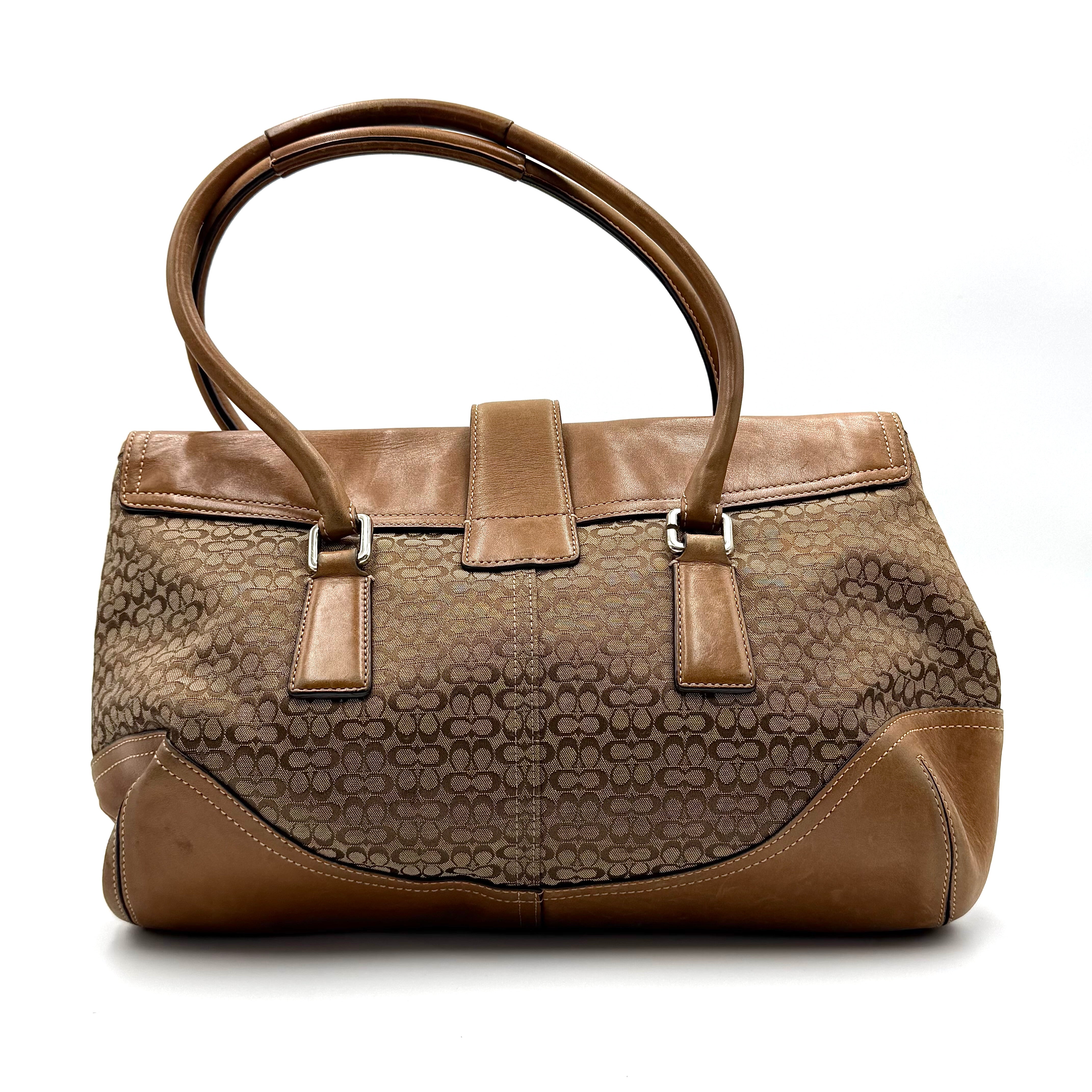 Coach Signature Soho shoulder bag in beige and tan canvas with leather trim and silver buckle.