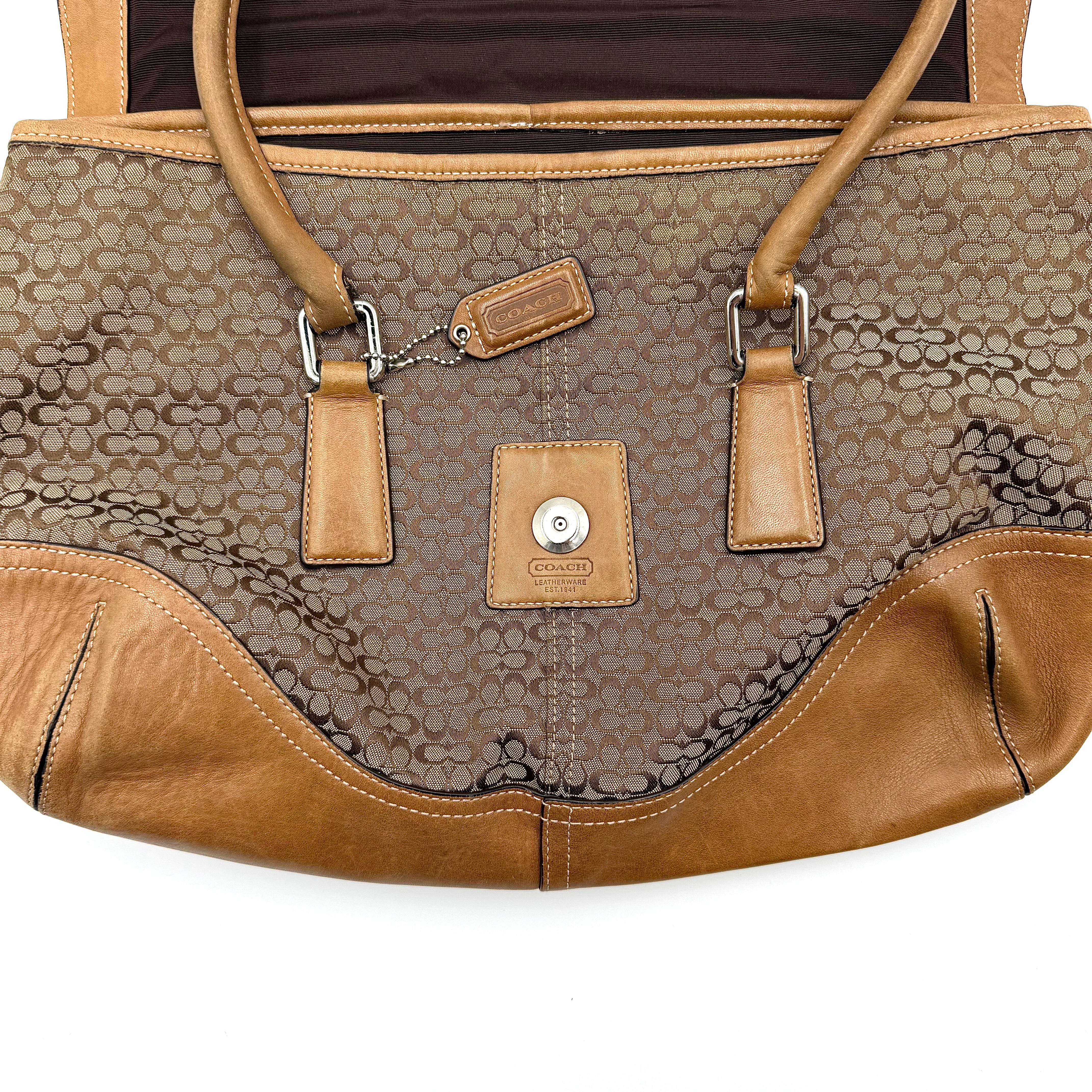 Coach Signature Soho shoulder bag in beige and tan canvas with leather trim and silver buckle.