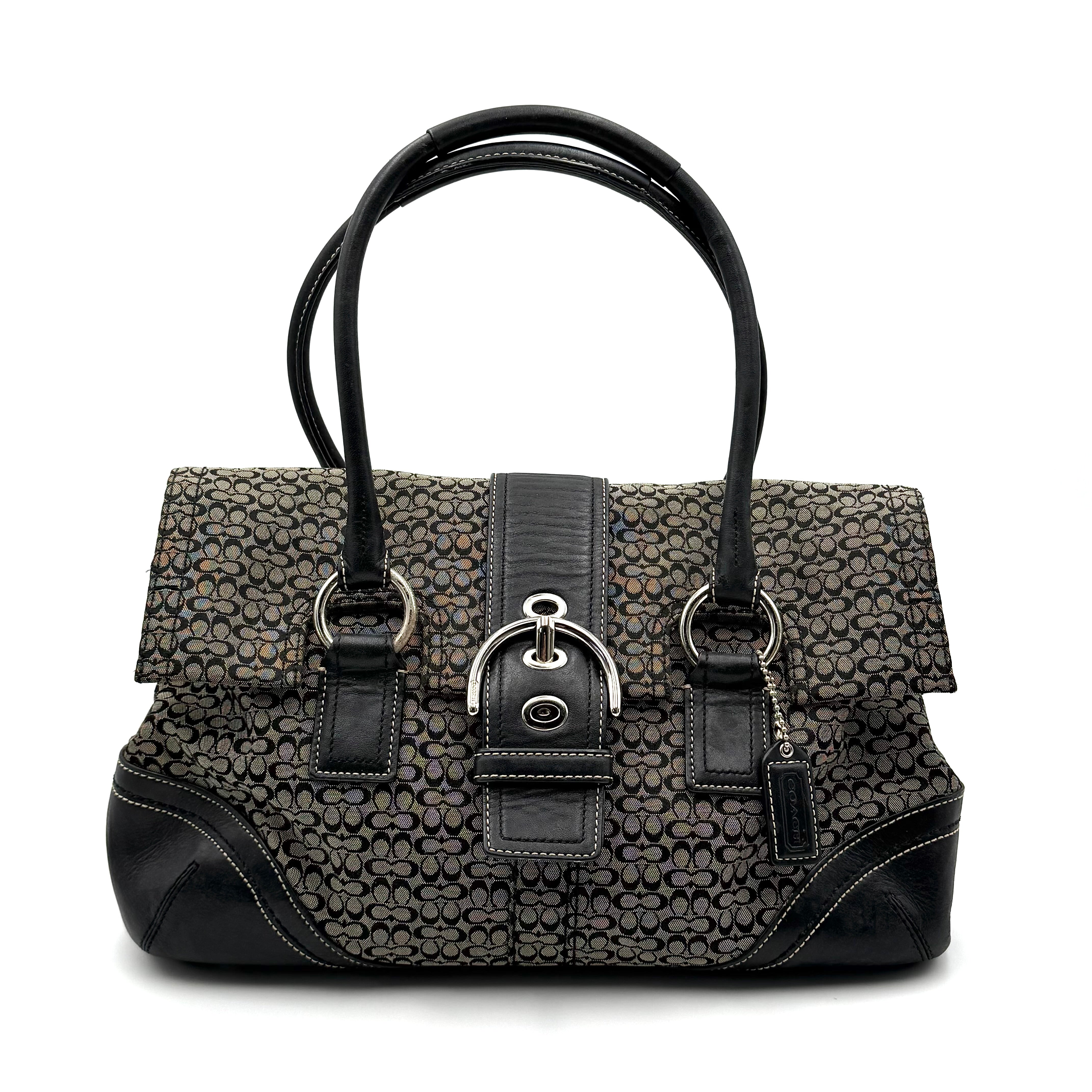 Coach Soho shoulder bag in grey and black jacquard with leather trim and silver hardware, presented with double top handles.