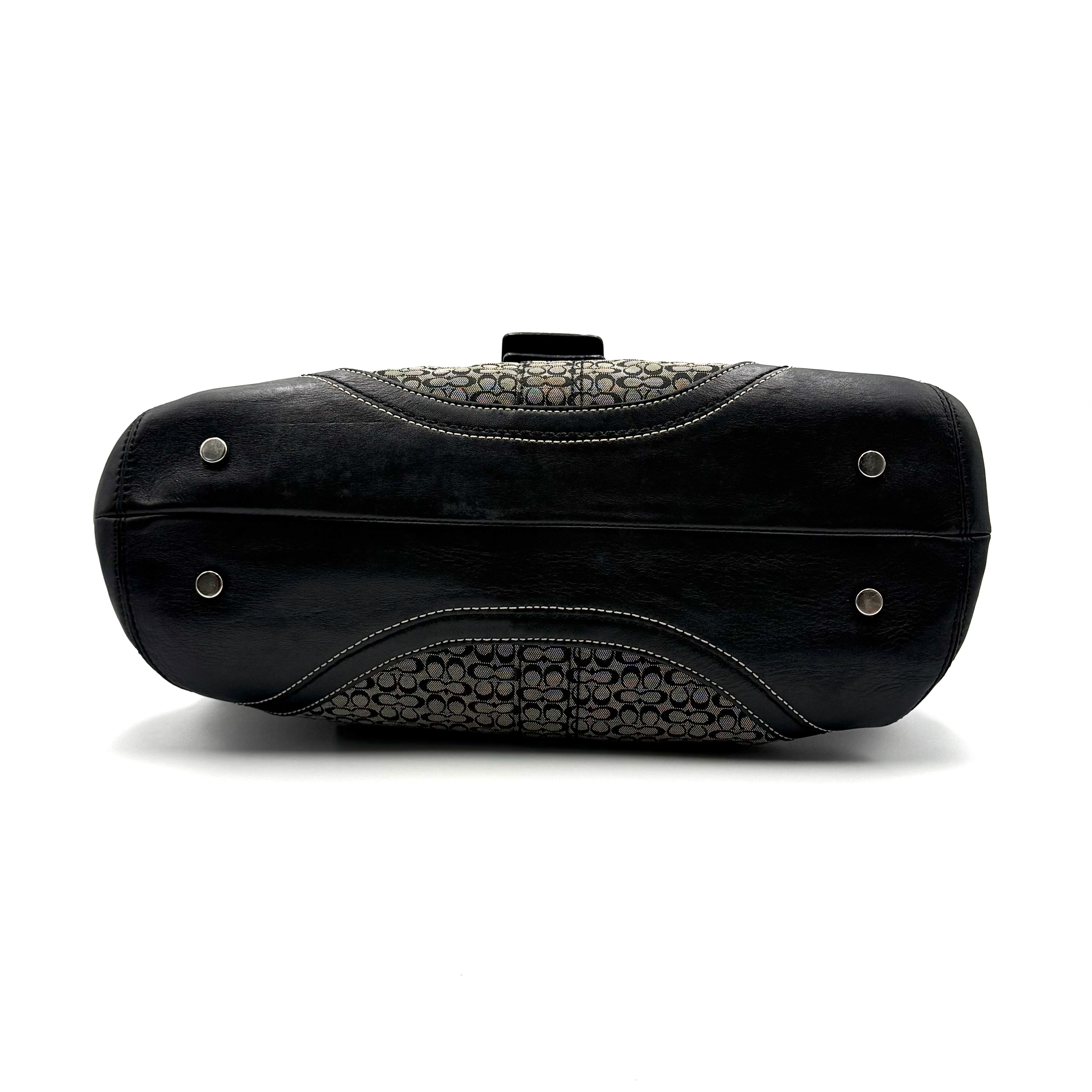 Coach Soho shoulder bag in grey and black jacquard with leather trim and silver hardware, presented with double top handles.