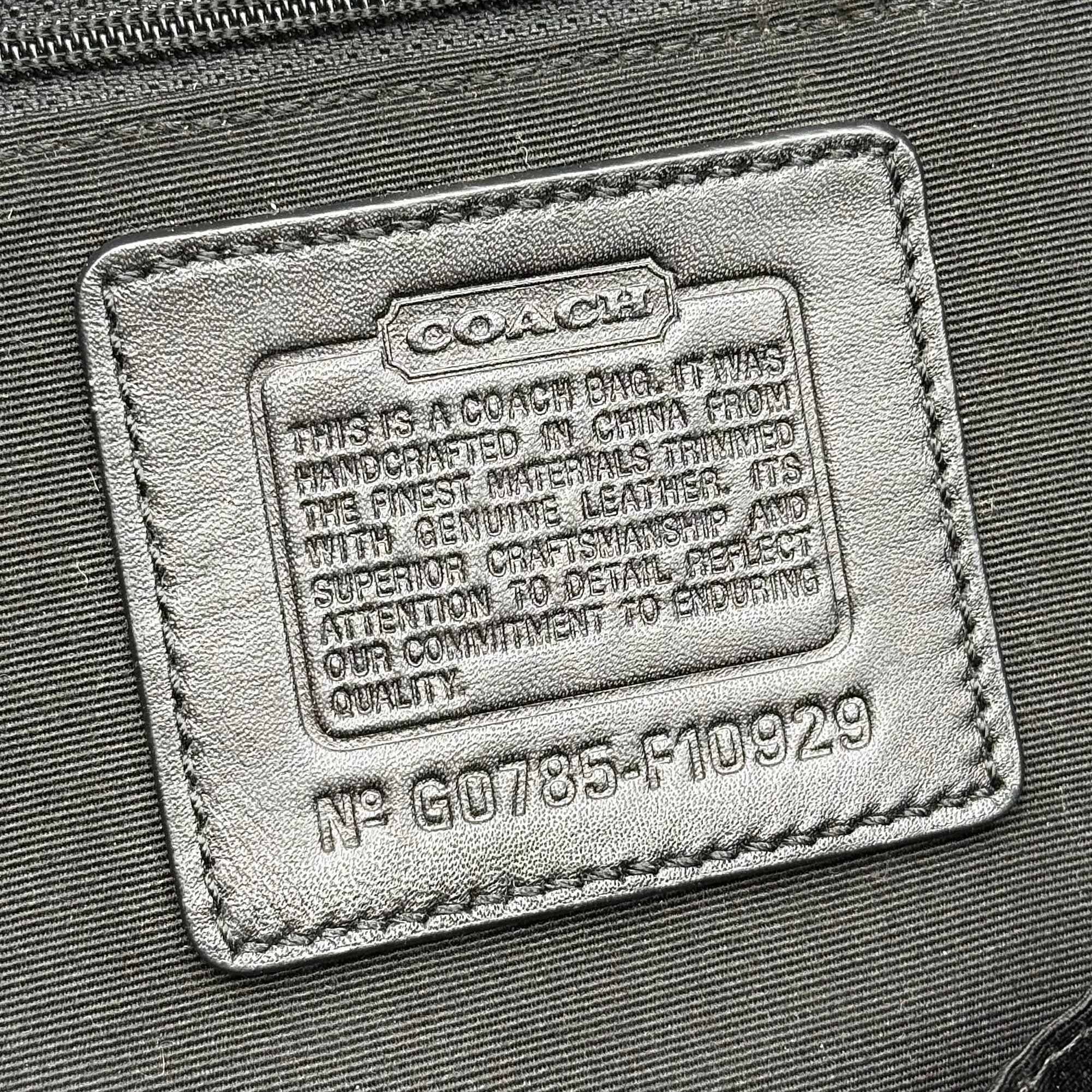 Coach Soho shoulder bag in grey and black jacquard with leather trim and silver hardware, presented with double top handles.