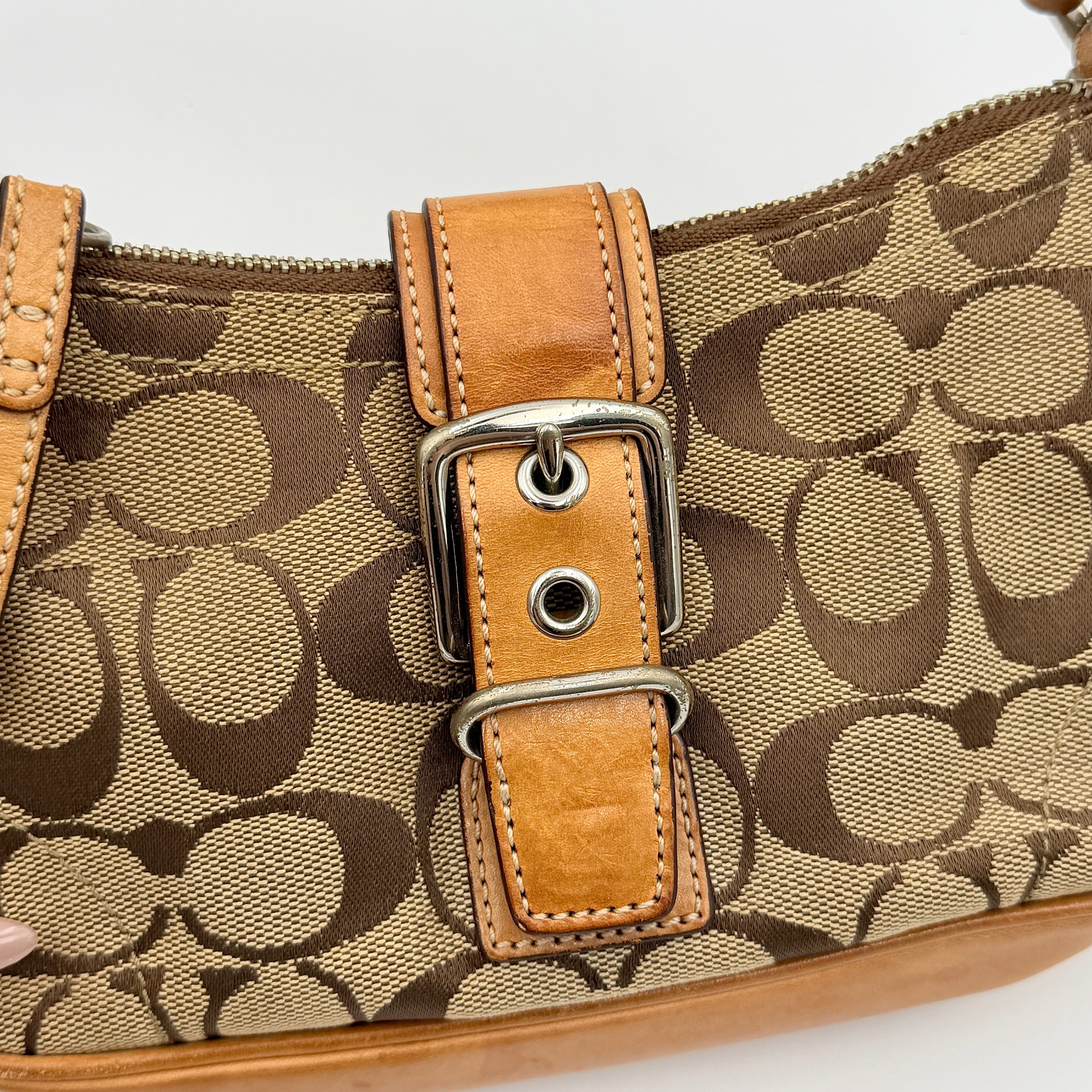 Coach Soho Demi shoulder bag in beige signature canvas with tan leather trim and silver hardware, shown with matching hangtag.