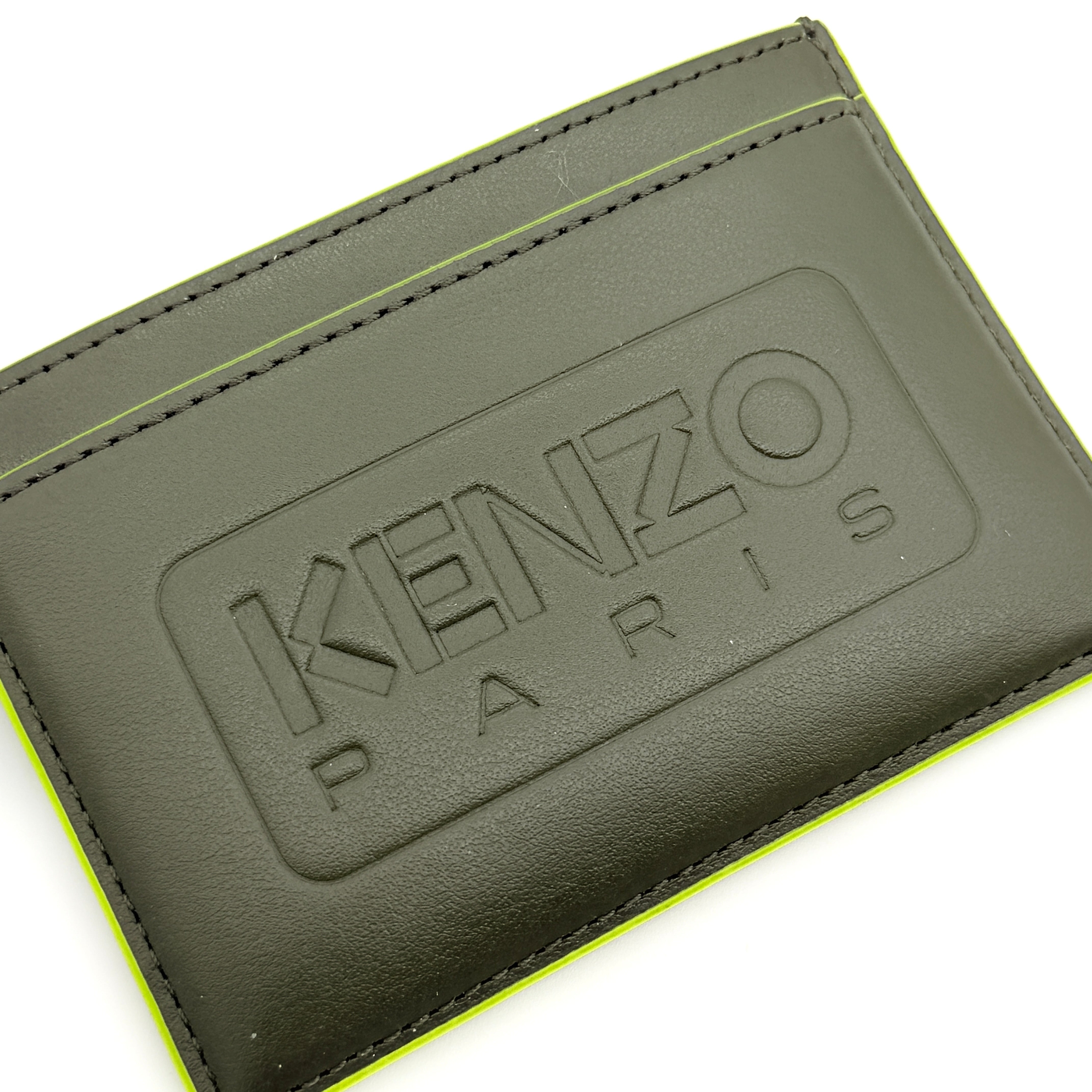 Kenzo Paris green leather card holder with embossed logo and neon yellow edging, shown with Kenzo Paris cards.