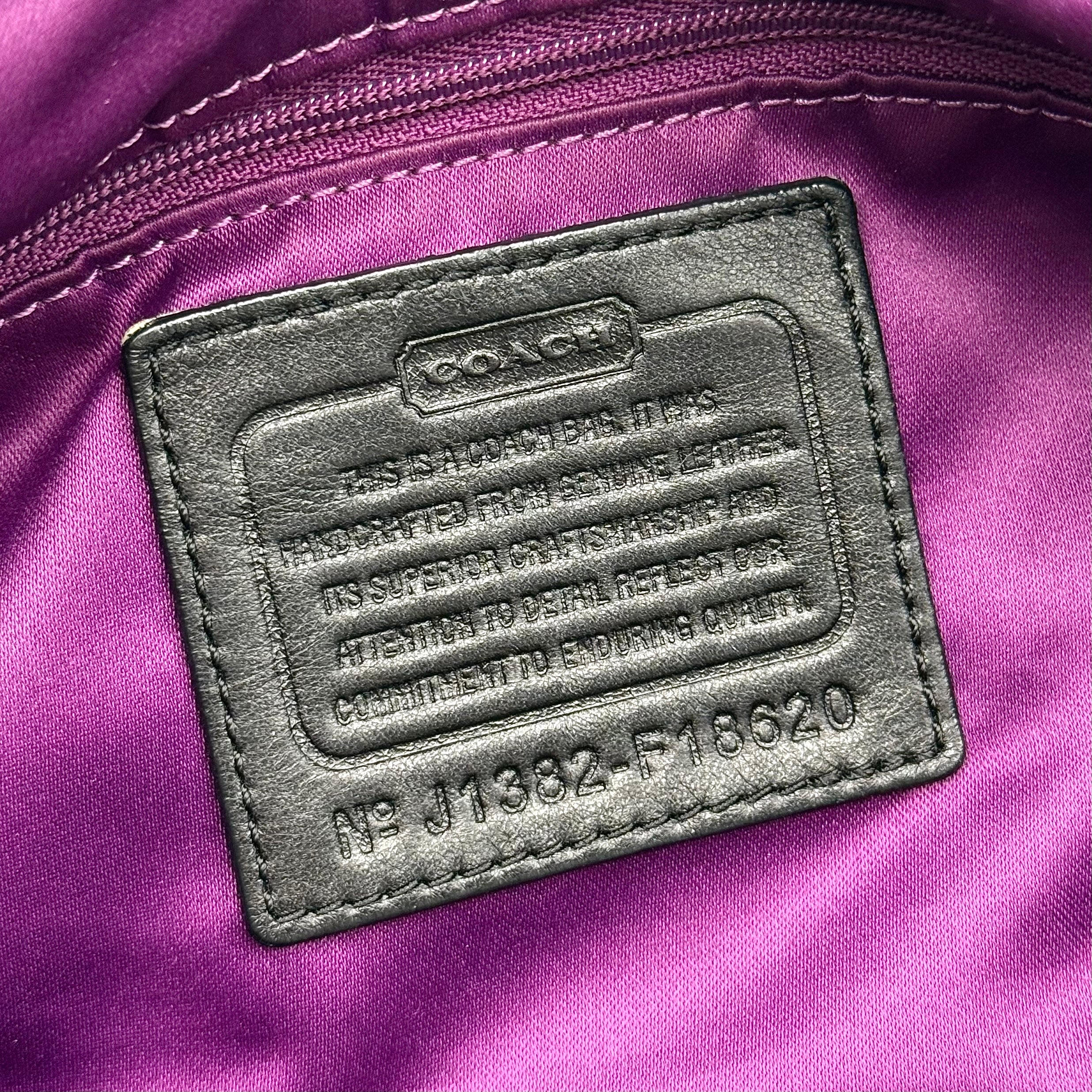 Coach Signature Madison shoulder bag in pleated black leather with gold hardware and dual handles.