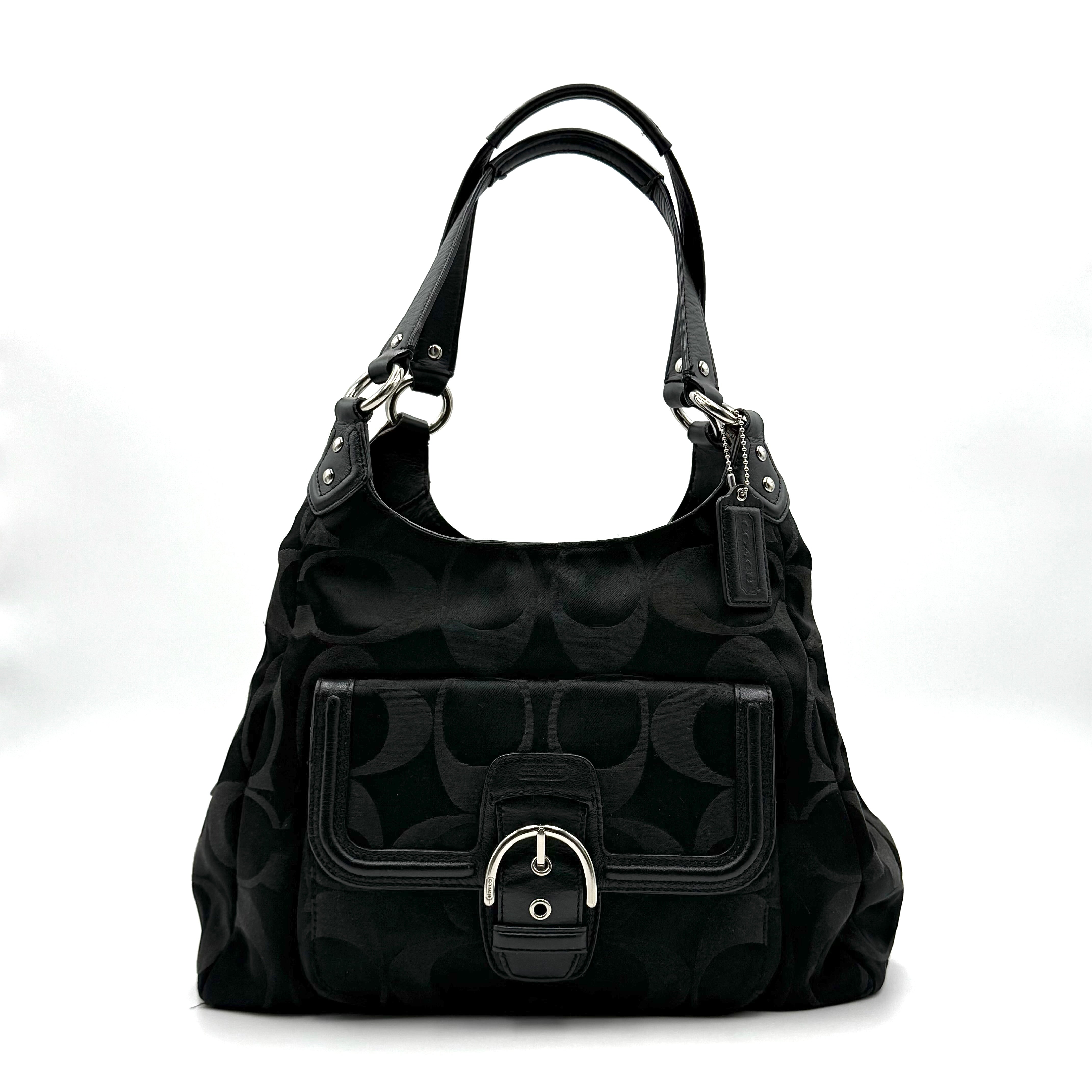 Coach Signature Campbell Hobo Shoulder Bag in black jacquard canvas with leather trim and front buckle pocket, photographed against a white background.