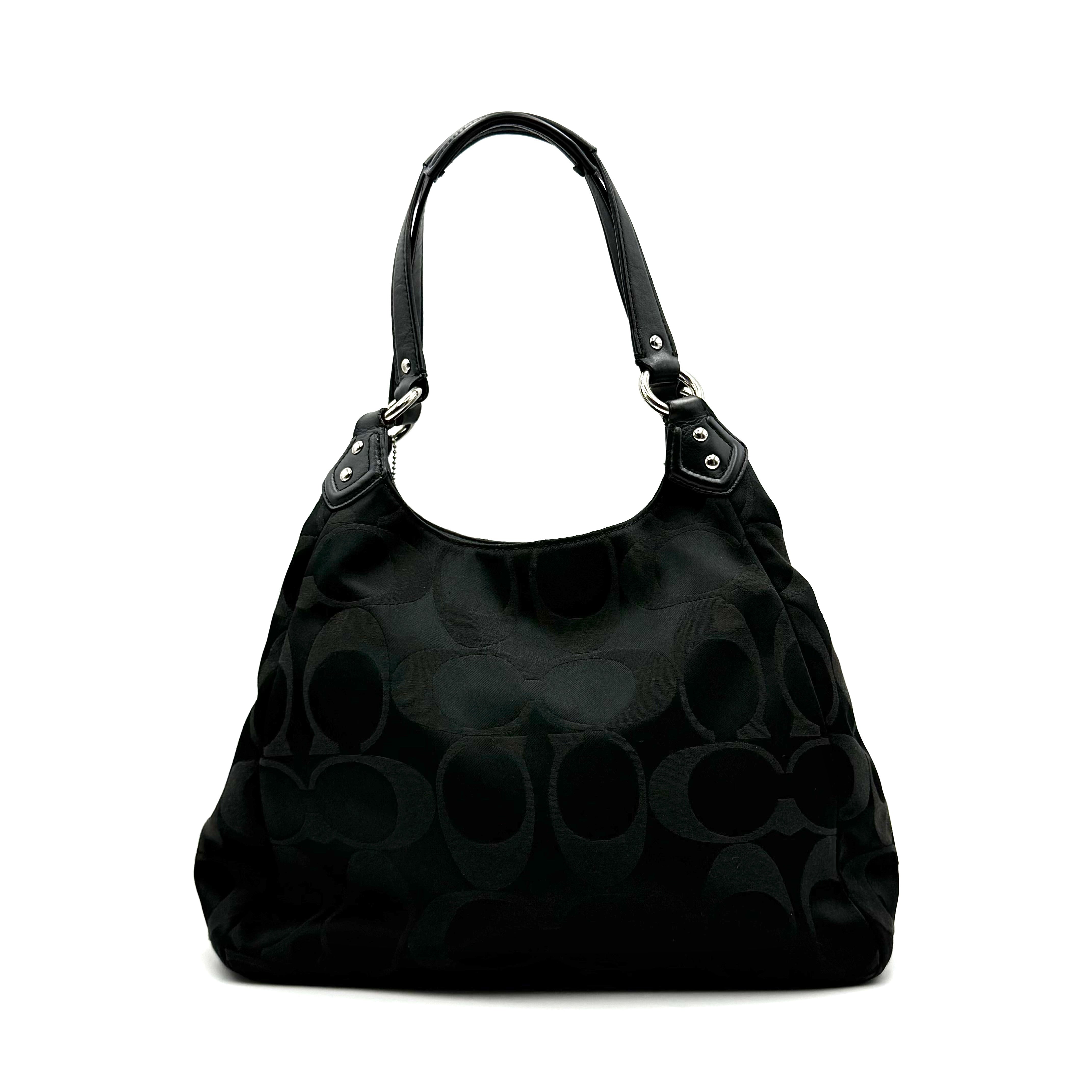 Coach Signature Campbell Hobo Shoulder Bag in black jacquard canvas with leather trim and front buckle pocket, photographed against a white background.