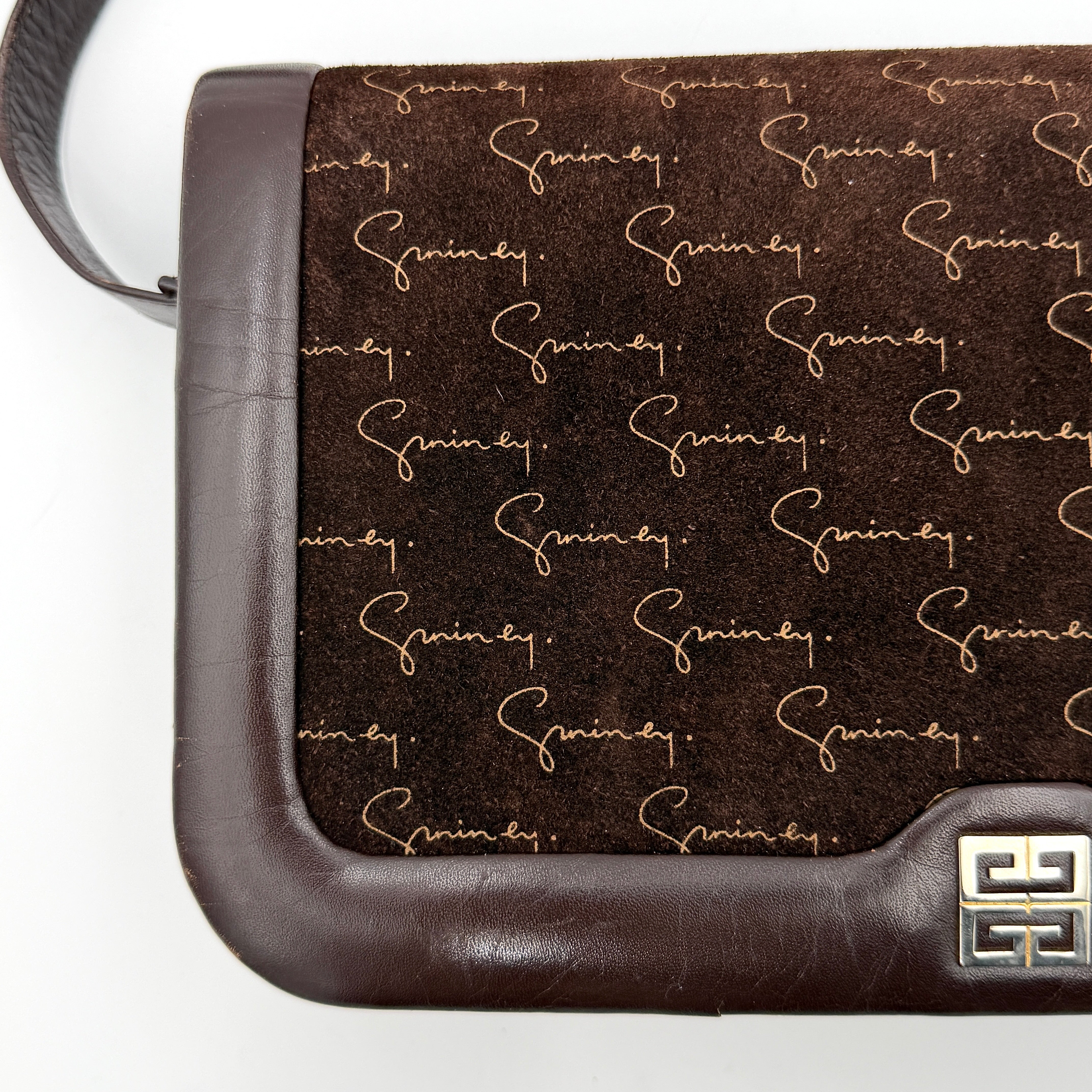 Givenchy 4G Monogram brown suede shoulder bag with leather trim and silver-tone clasp, photographed on a white background.